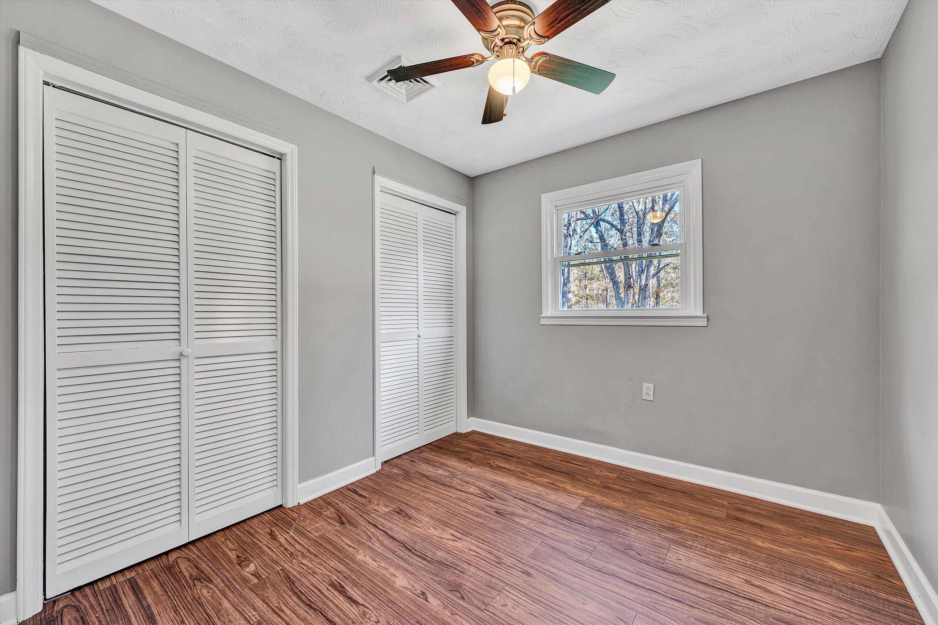 304 Broken Arrow Lane Covington, VA 24426 - Photo 21 of 46 a view of empty room with wooden floor