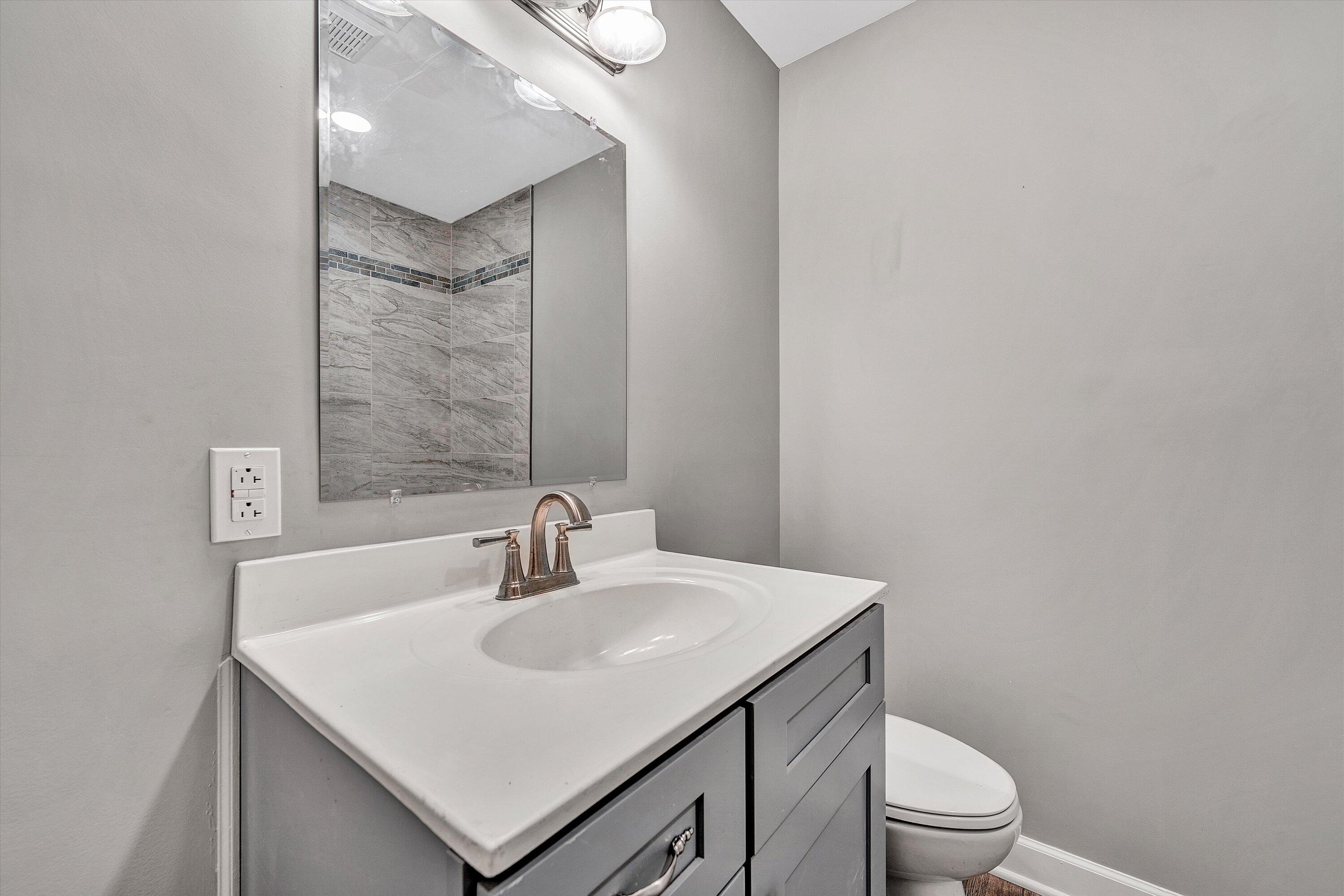 304 Broken Arrow Lane Covington, VA 24426 - Photo 23 of 46 a bathroom with a sink toilet and mirror