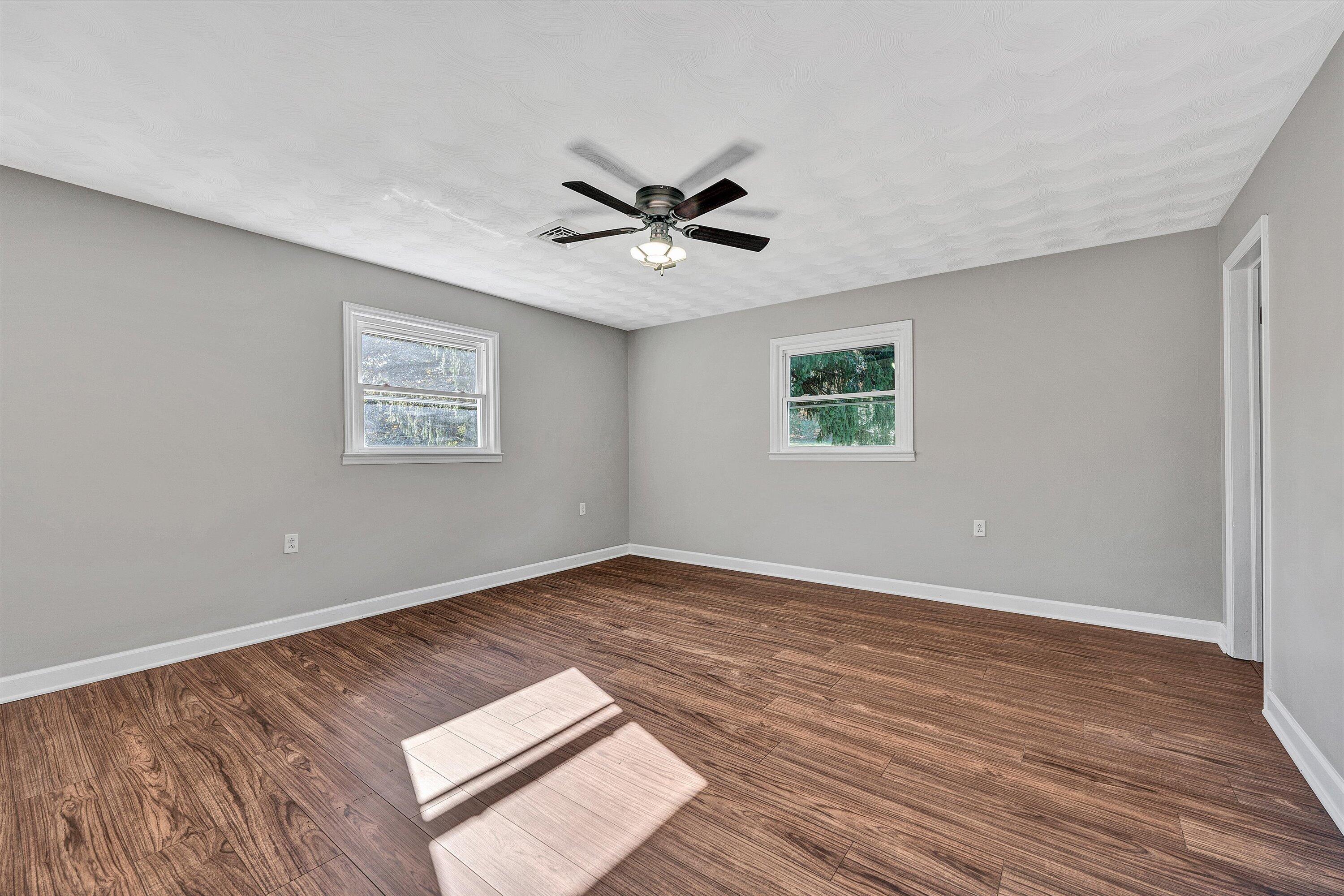 304 Broken Arrow Lane Covington, VA 24426 - Photo 26 of 46 wooden floor in an empty room with a window