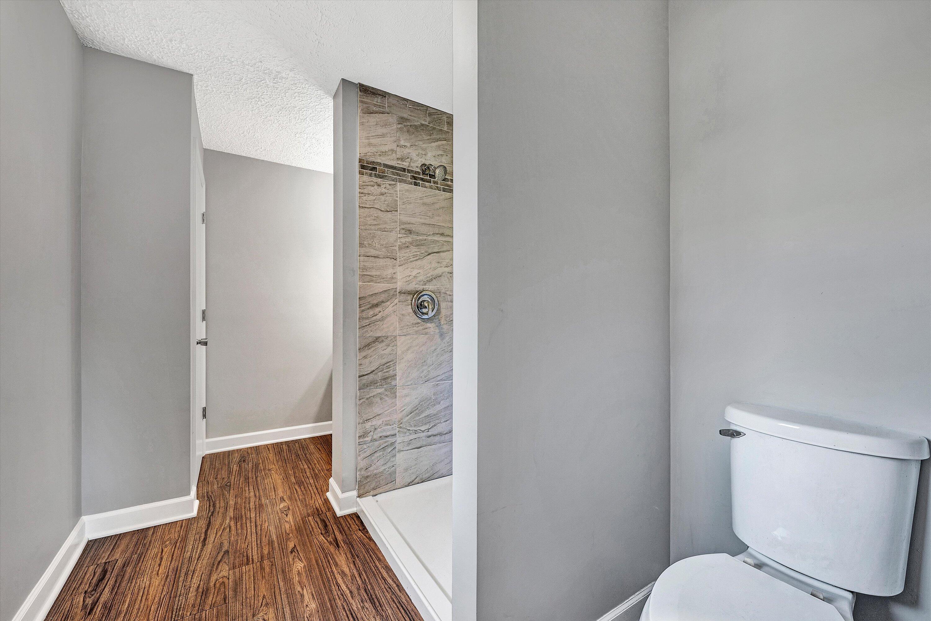 304 Broken Arrow Lane Covington, VA 24426 - Photo 28 of 46 a bathroom with a toilet and a shower