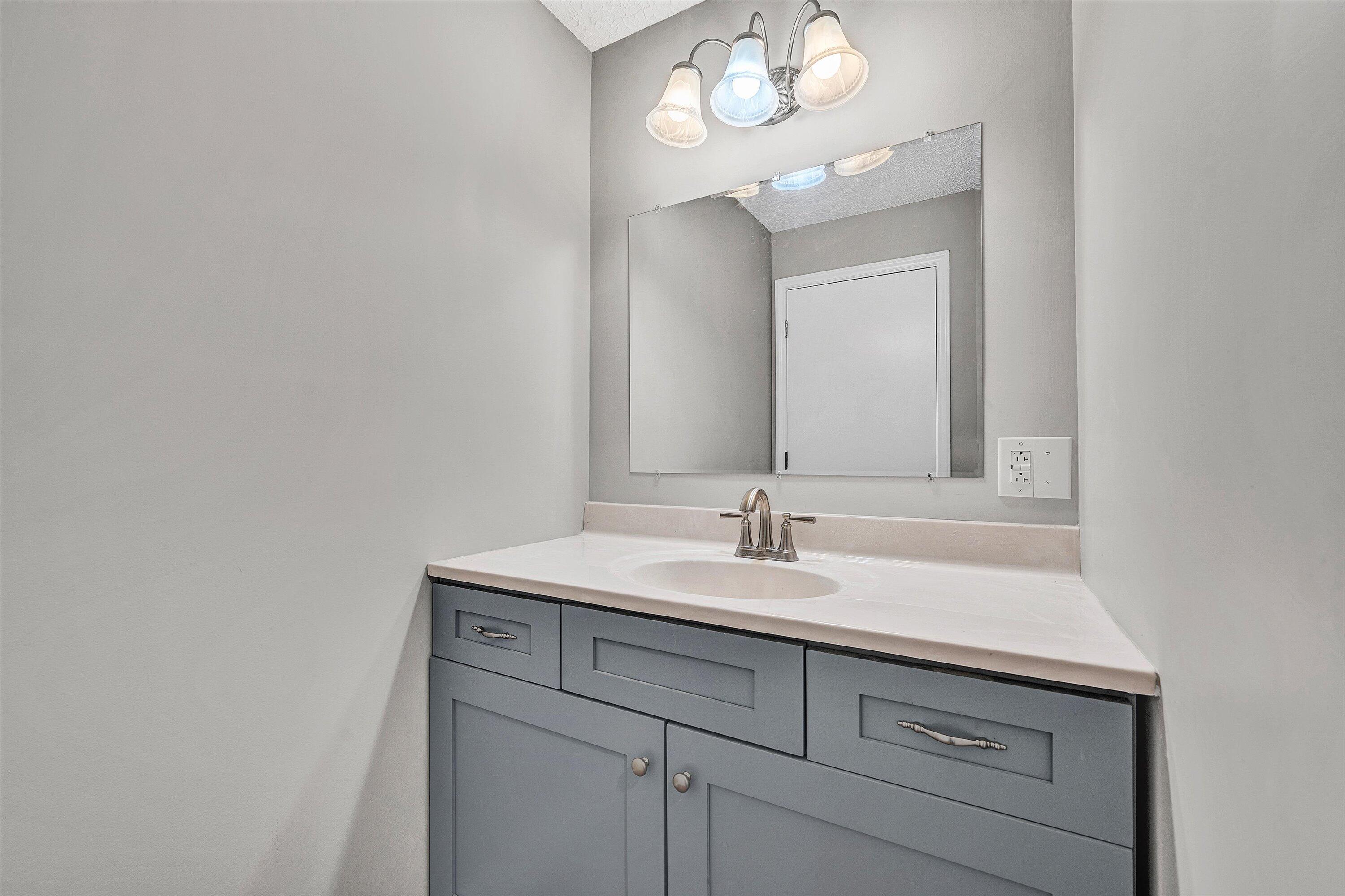 304 Broken Arrow Lane Covington, VA 24426 - Photo 30 of 46 a bathroom with a sink and a mirror