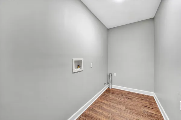 a view of a storage & utility room with two washing machine