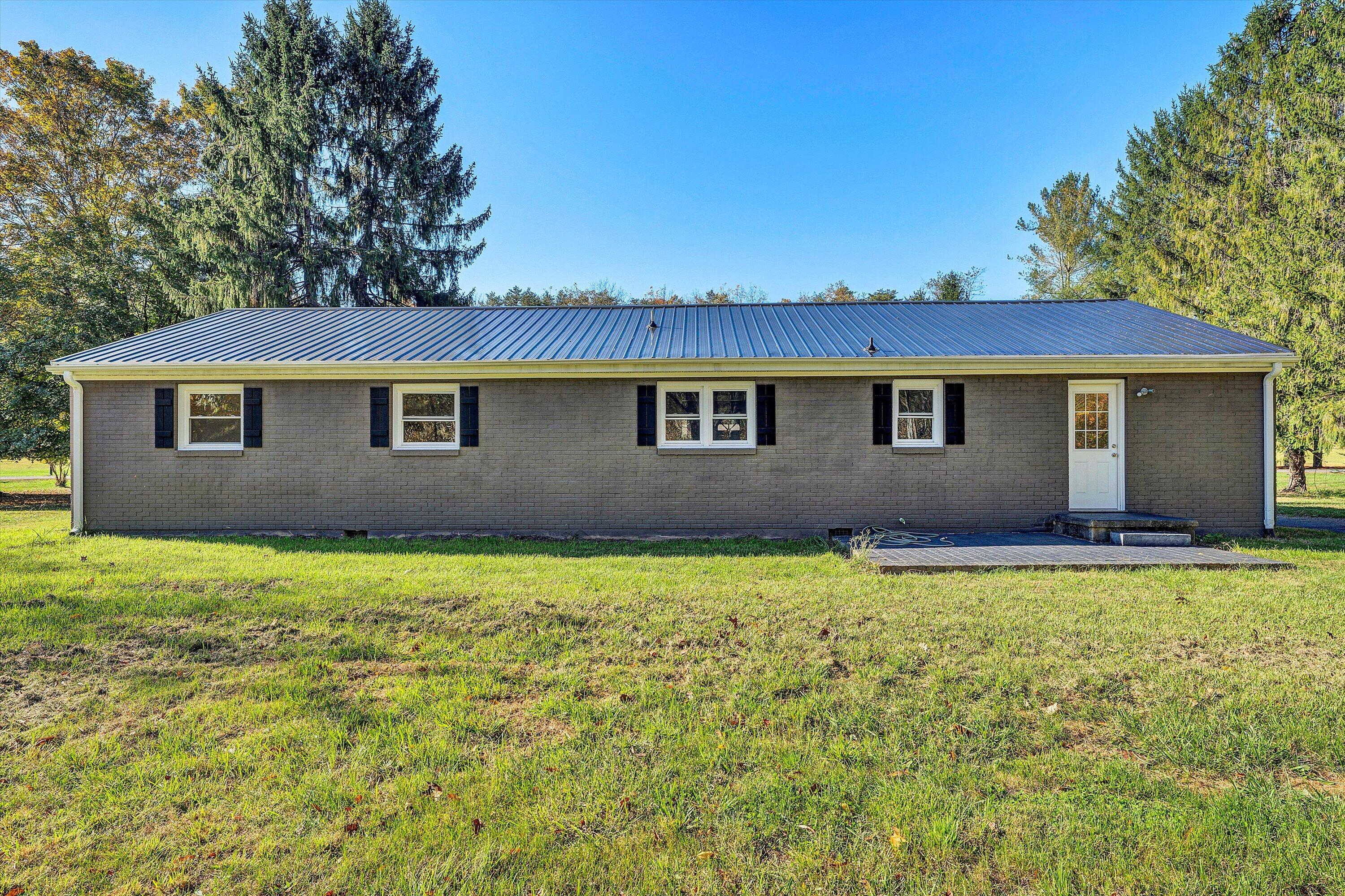 304 Broken Arrow Lane Covington, VA 24426 - Photo 40 of 46 a view of a house with backyard and garden