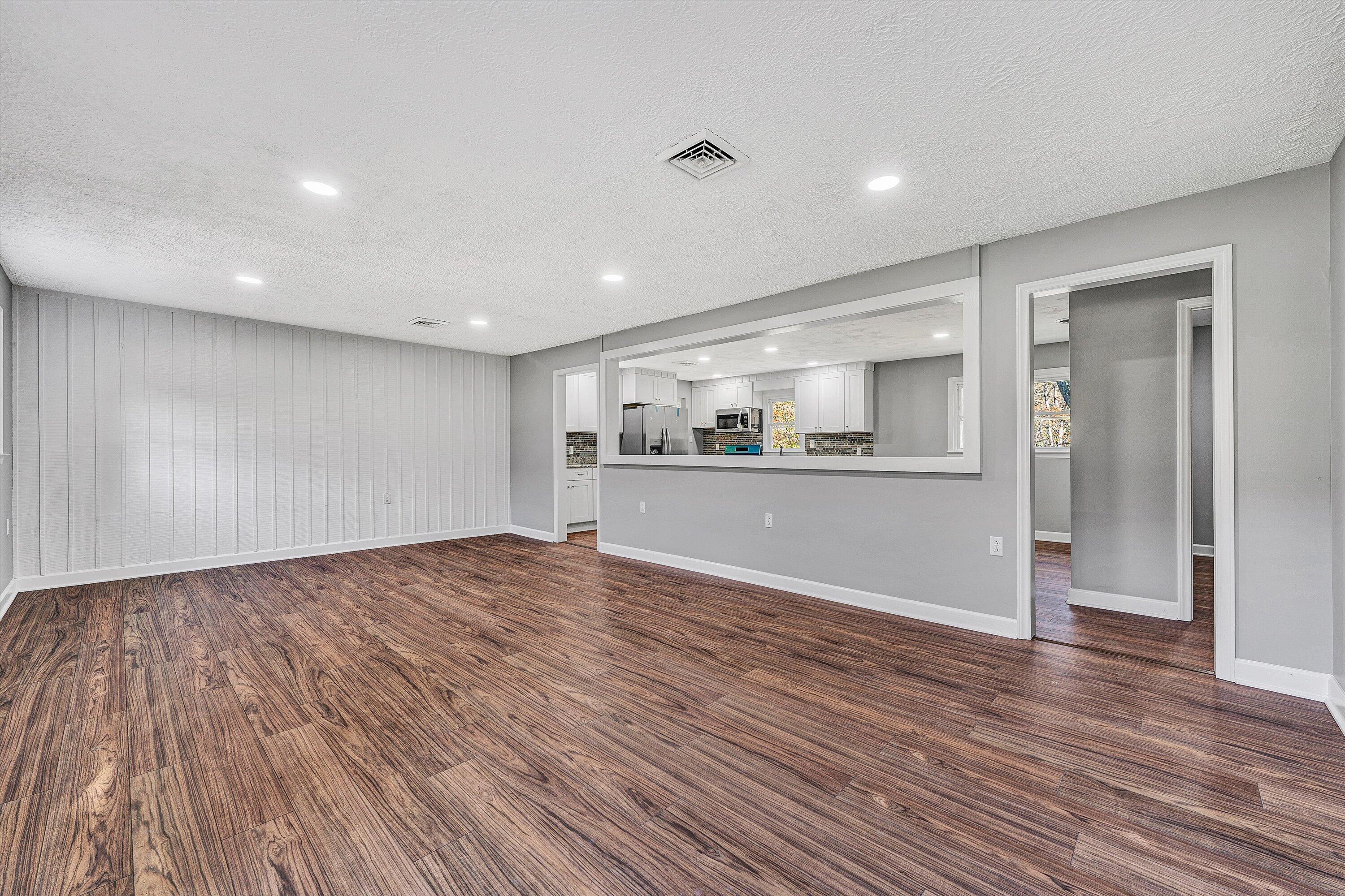 304 Broken Arrow Lane Covington, VA 24426 - Photo 10 of 46 a view of a kitchen with a fridge and wooden floor