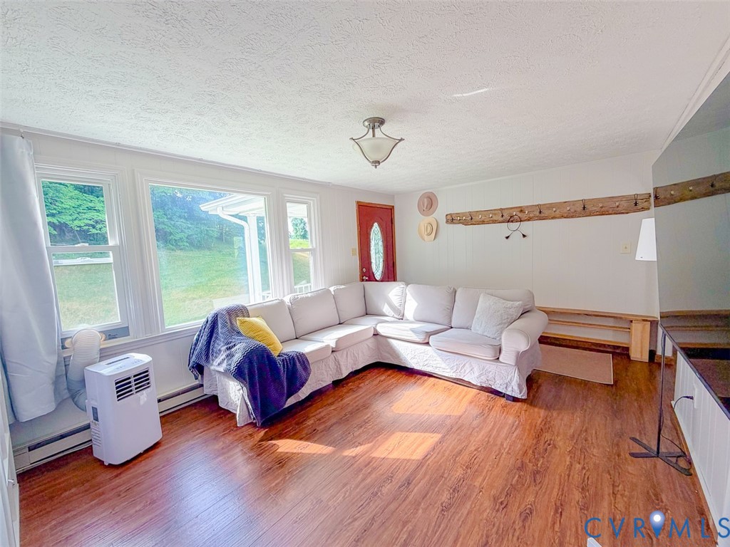 453 Long Hollow Road Cleveland, VA 24225 - Photo 16 of 50 a living room with furniture and wooden floor