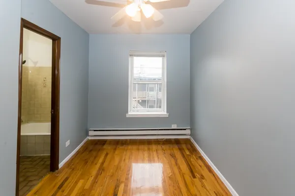 a view of a room with wooden floor and balcony