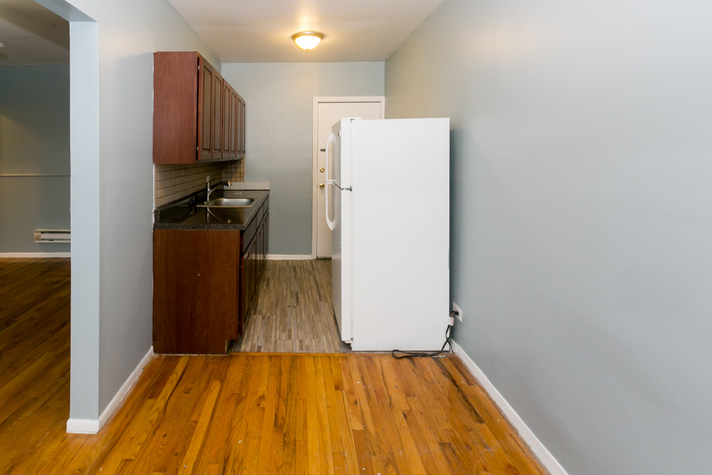 4515 North Malden Street, Unit 3C Chicago, IL 60640 - Photo 5 of 18 a view of a storage & utility room with wooden floor
