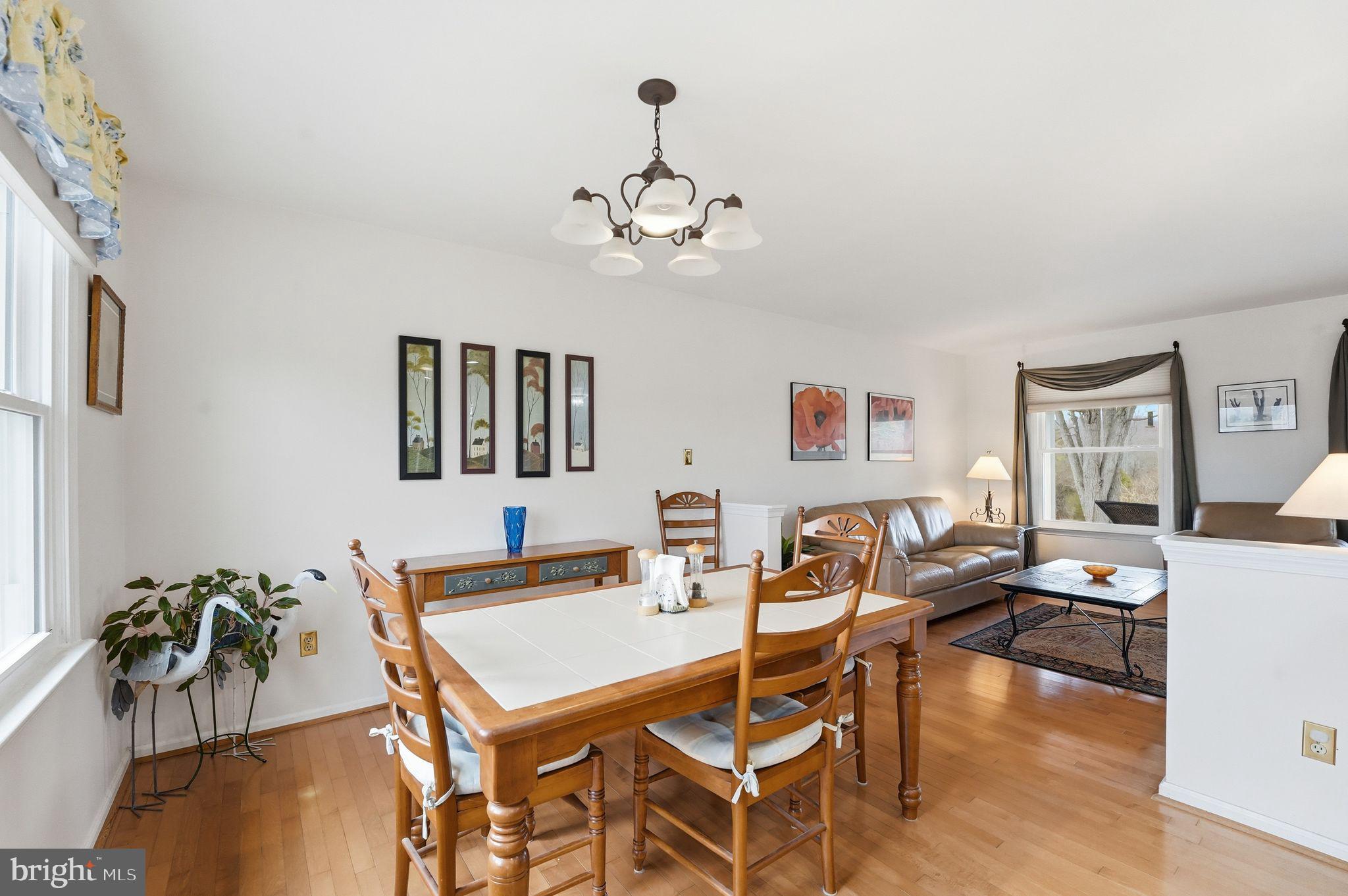 4051 Ringwood Road Nokesville, VA 20181 - Photo 16 of 58 a living room with furniture a dining table and a potted plant