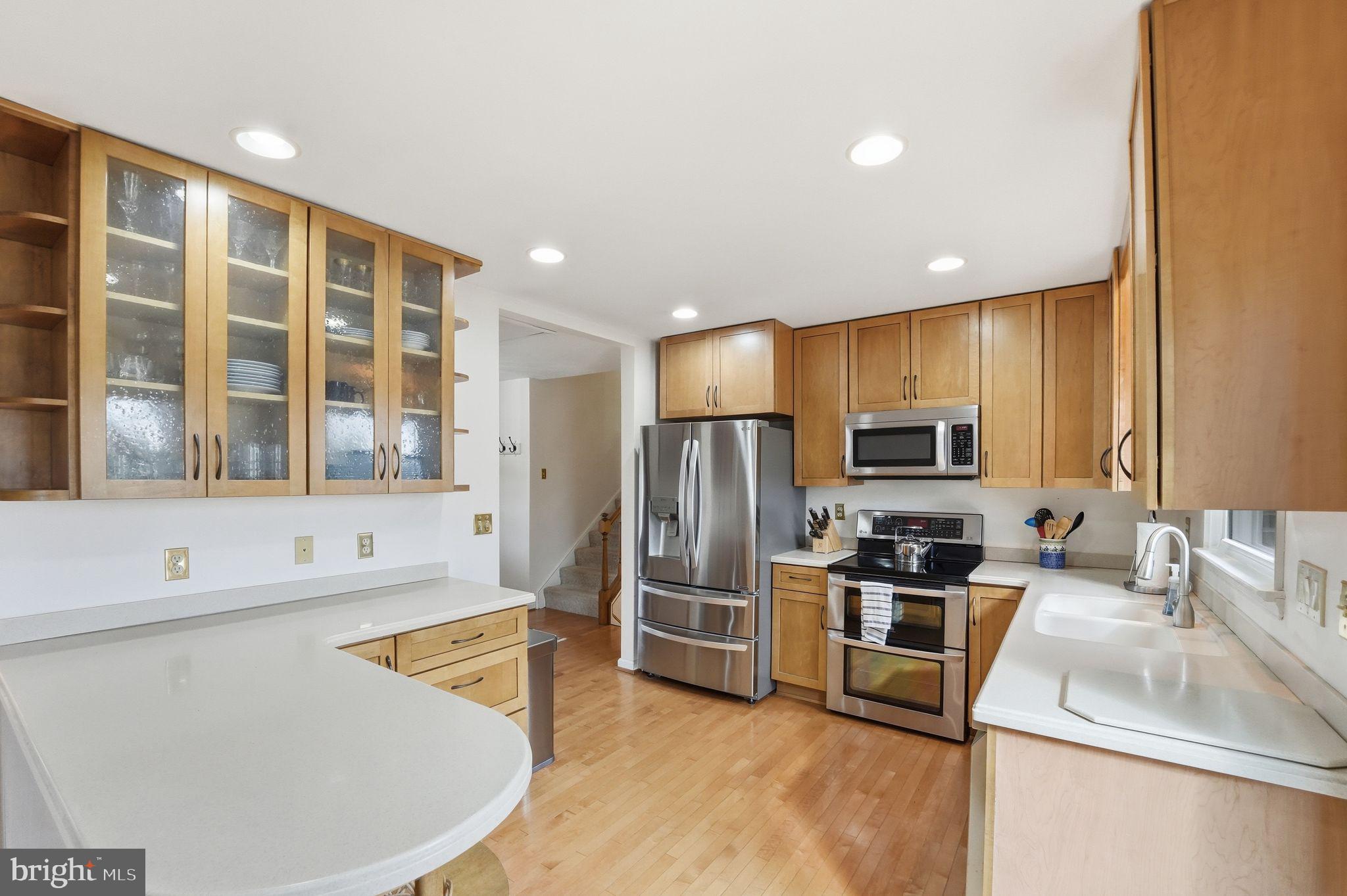 4051 Ringwood Road Nokesville, VA 20181 - Photo 18 of 58 a kitchen with stainless steel appliances granite countertop a sink and a refrigerator