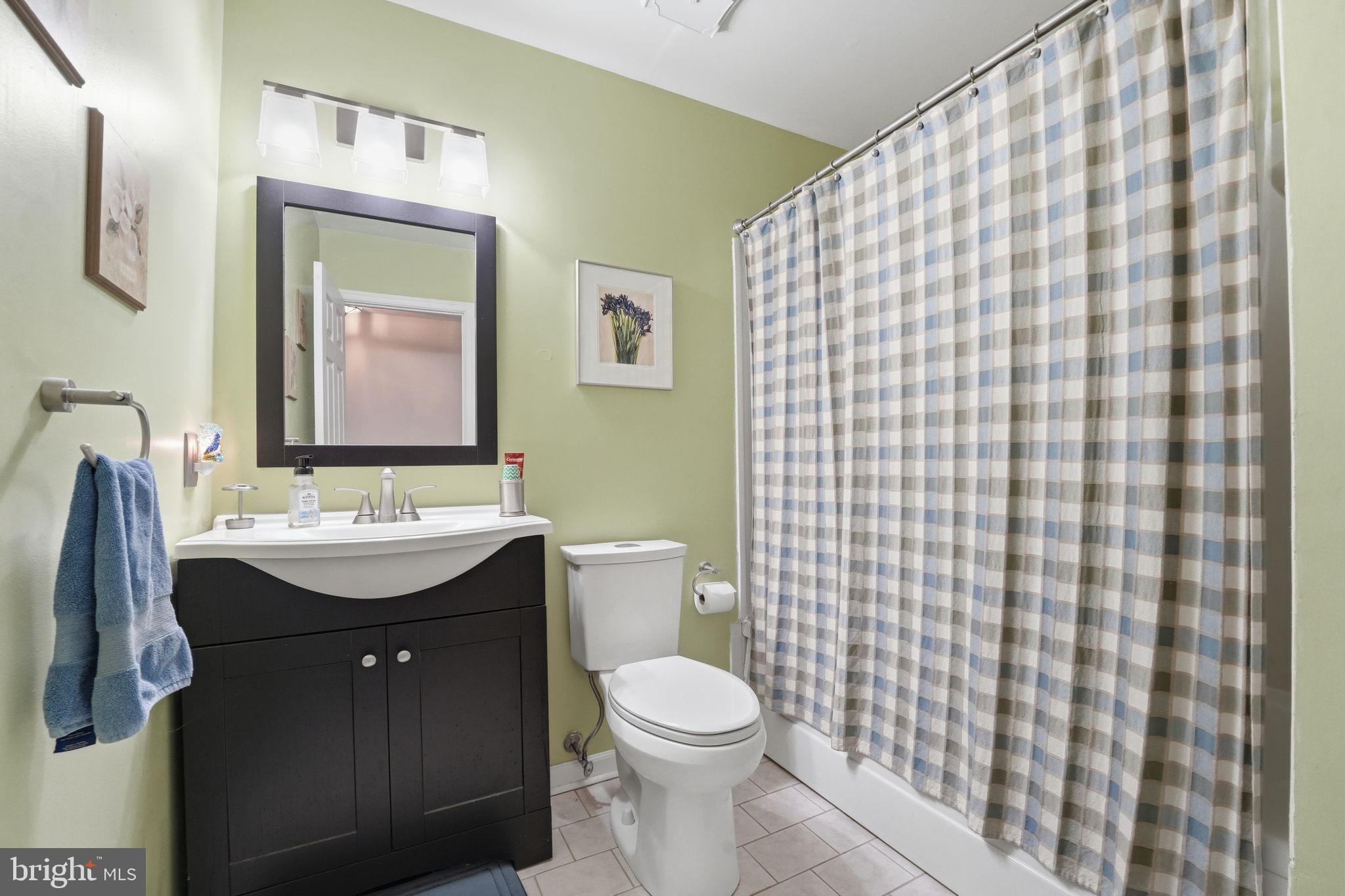 4051 Ringwood Road Nokesville, VA 20181 - Photo 25 of 58 a bathroom with a sink a toilet and mirror