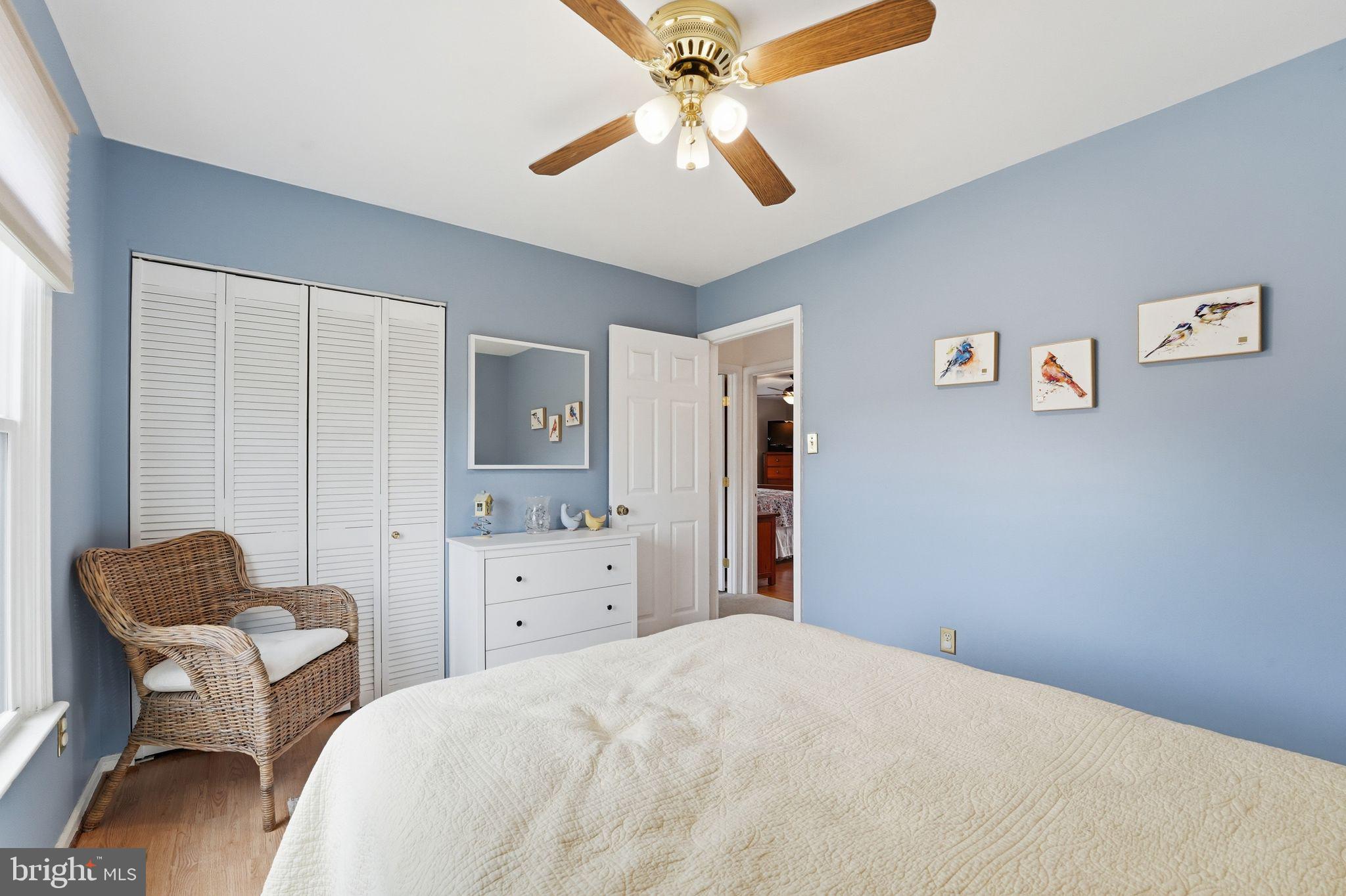 4051 Ringwood Road Nokesville, VA 20181 - Photo 27 of 58 a bedroom with a bed and a chandelier