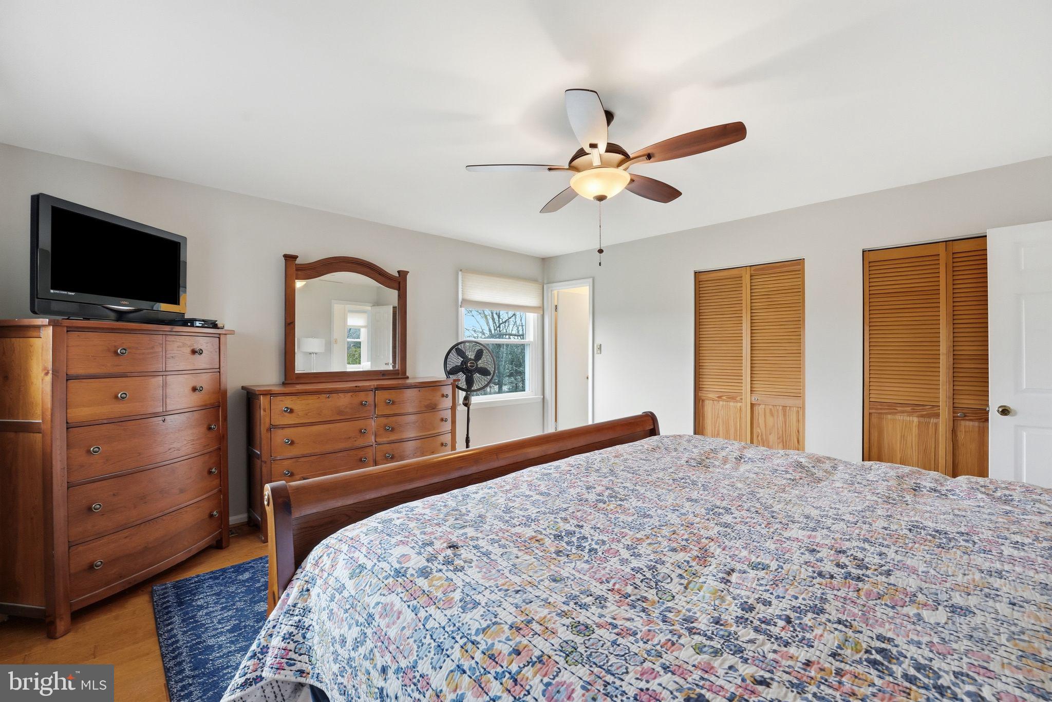 4051 Ringwood Road Nokesville, VA 20181 - Photo 31 of 58 a bedroom with a large bed and flat tv screen on dresser