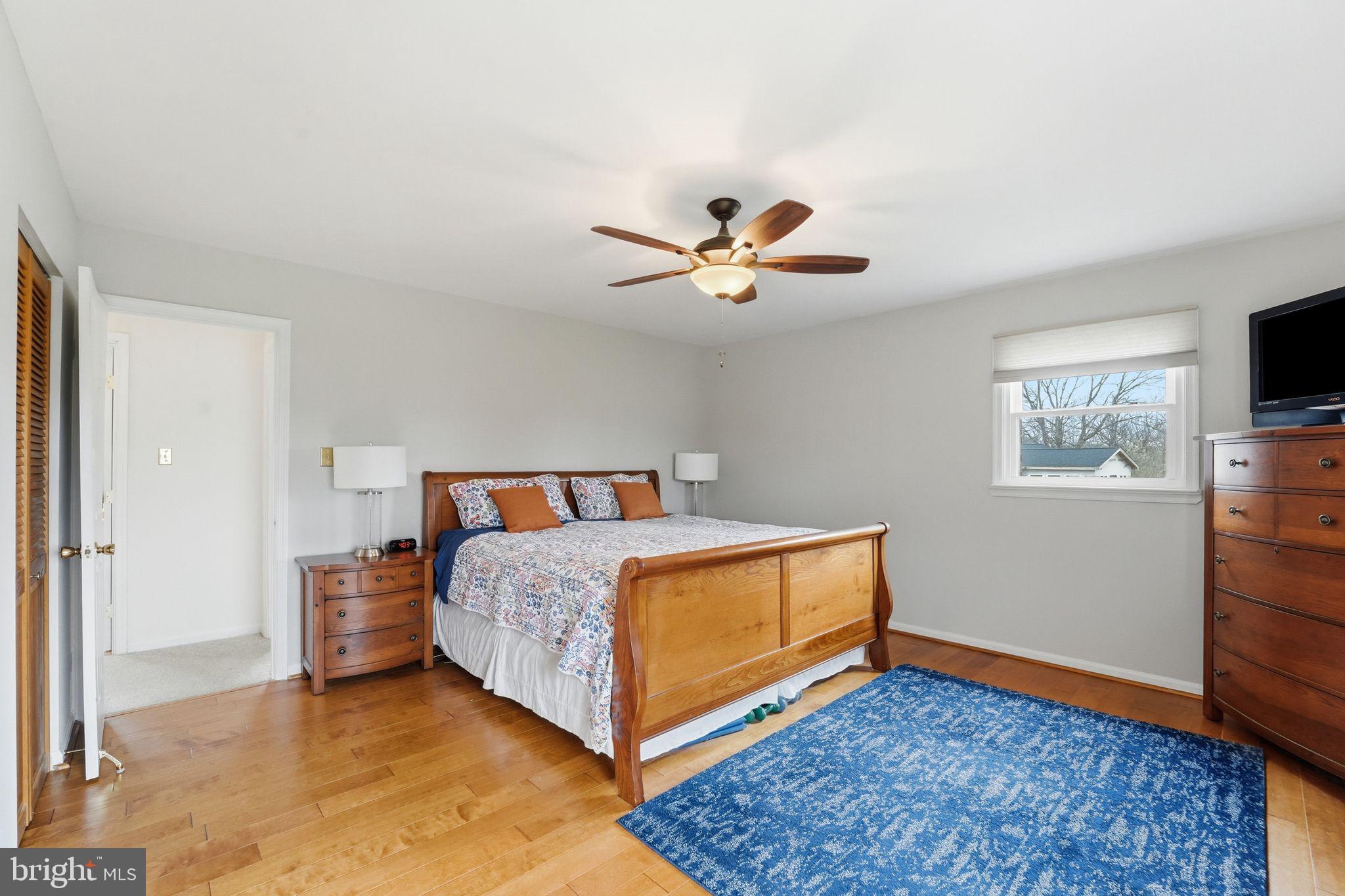 4051 Ringwood Road Nokesville, VA 20181 - Photo 32 of 58 a bedroom with a bed and a ceiling fan