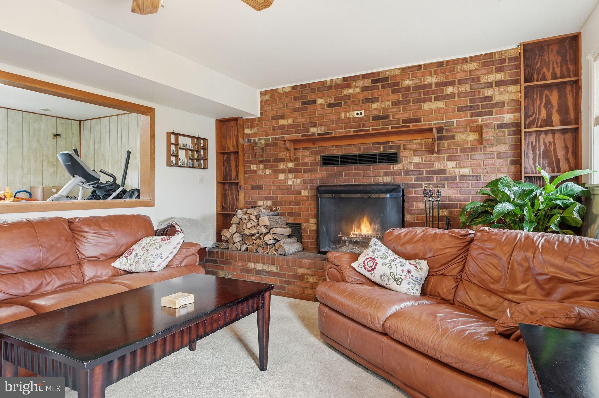 4051 Ringwood Road Nokesville, VA 20181 - Photo 35 of 58 a living room with furniture and a fireplace