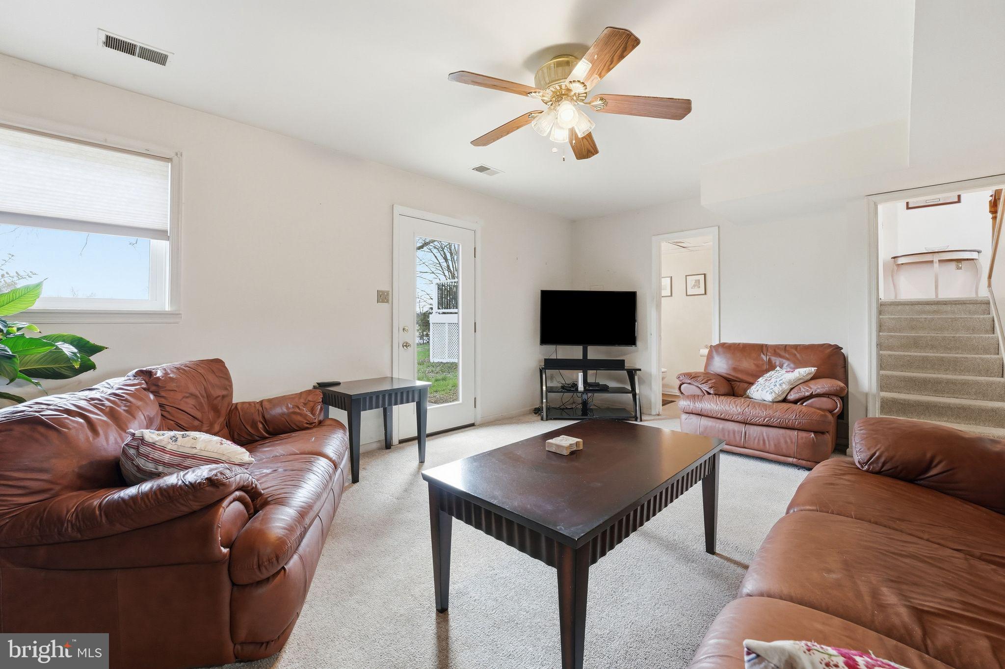 4051 Ringwood Road Nokesville, VA 20181 - Photo 36 of 58 a living room with furniture and a flat screen tv