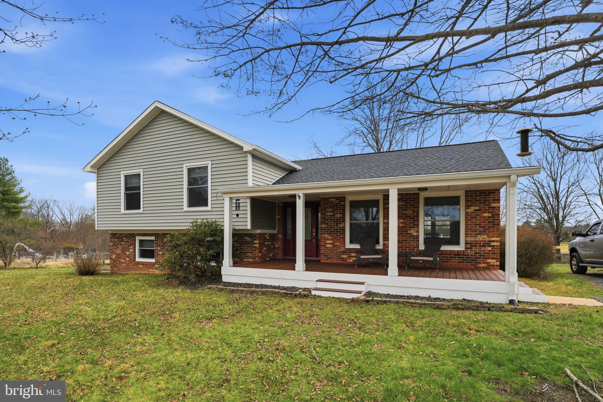 4051 Ringwood Road Nokesville, VA 20181 - Photo 39 of 58 front view of a house with a yard