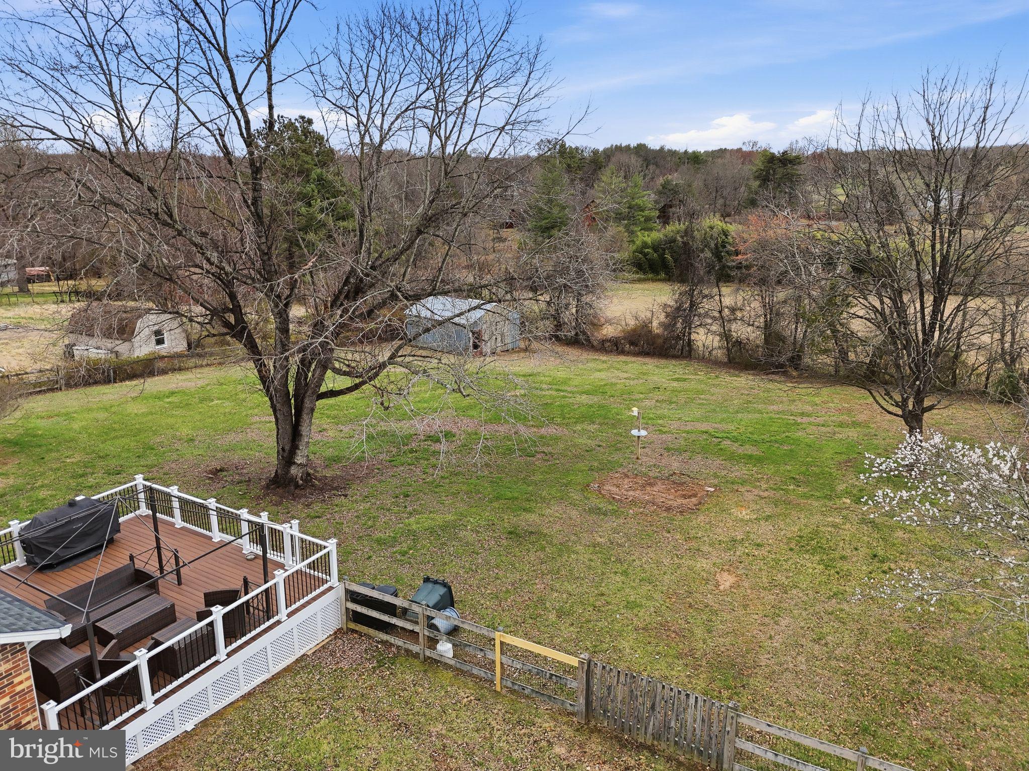 4051 Ringwood Road Nokesville, VA 20181 - Photo 5 of 58 a view of backyard with mountain and trees