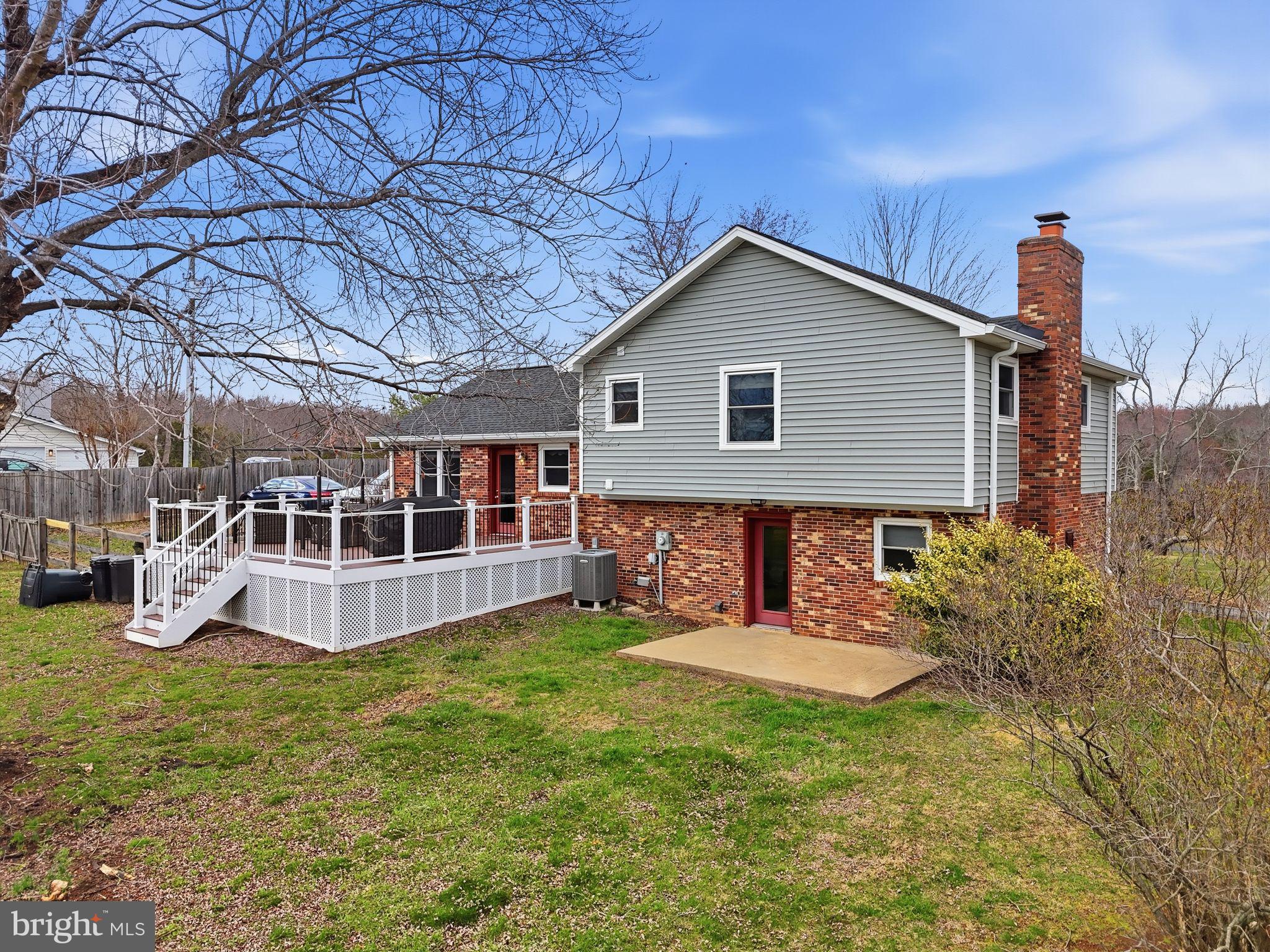 4051 Ringwood Road Nokesville, VA 20181 - Photo 8 of 58 a view of a house with backyard and plants