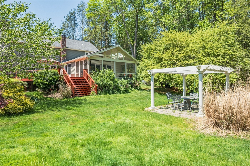 7 Beechwood Circle Boxford, MA 01921 - Photo 6 of 7 a front view of a house with a yard