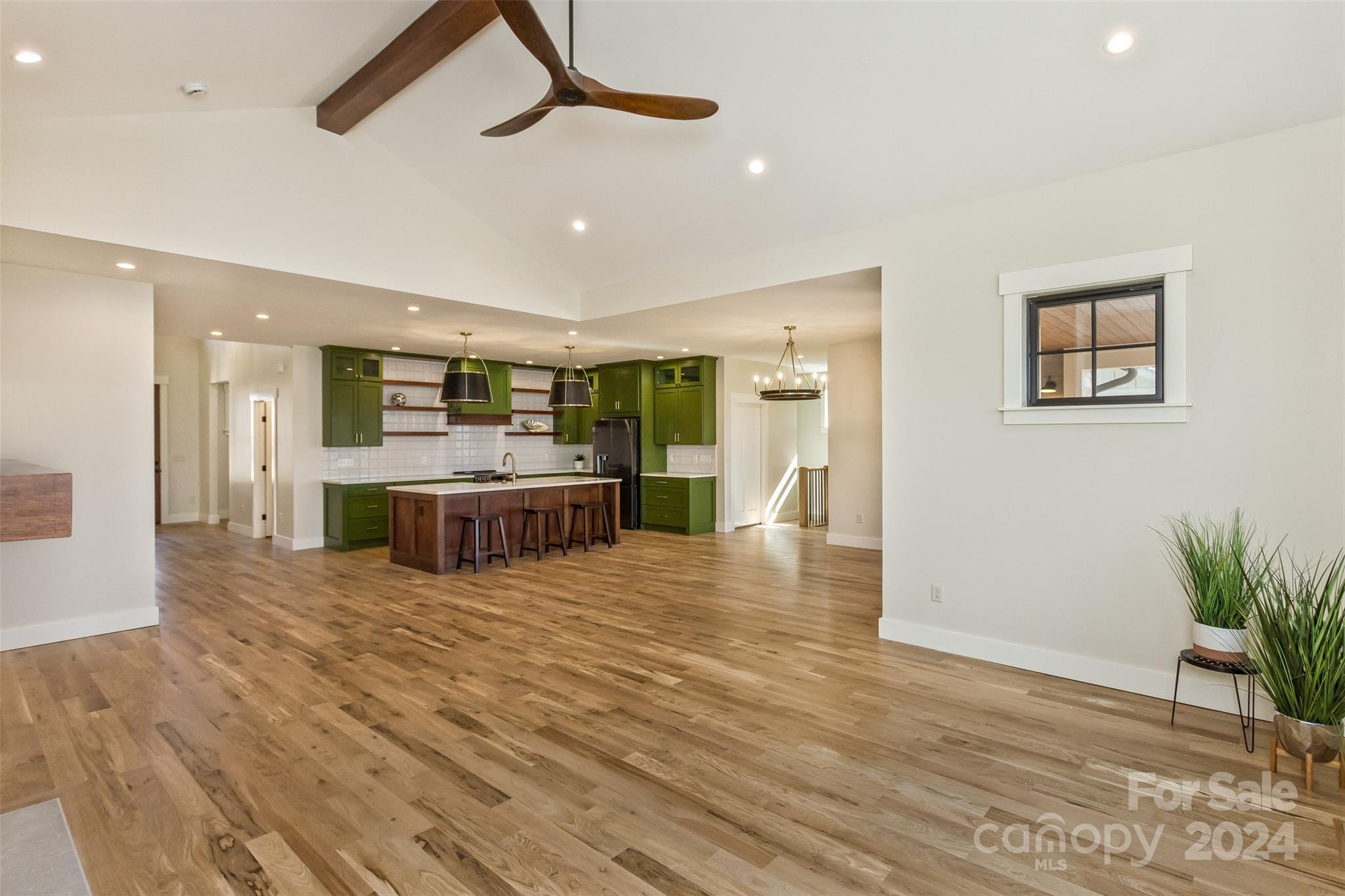 157 Gashes Creek Road Asheville, NC 28805 - Photo 11 of 43 a large kitchen with stainless steel appliances kitchen island a large counter top and a wooden floors