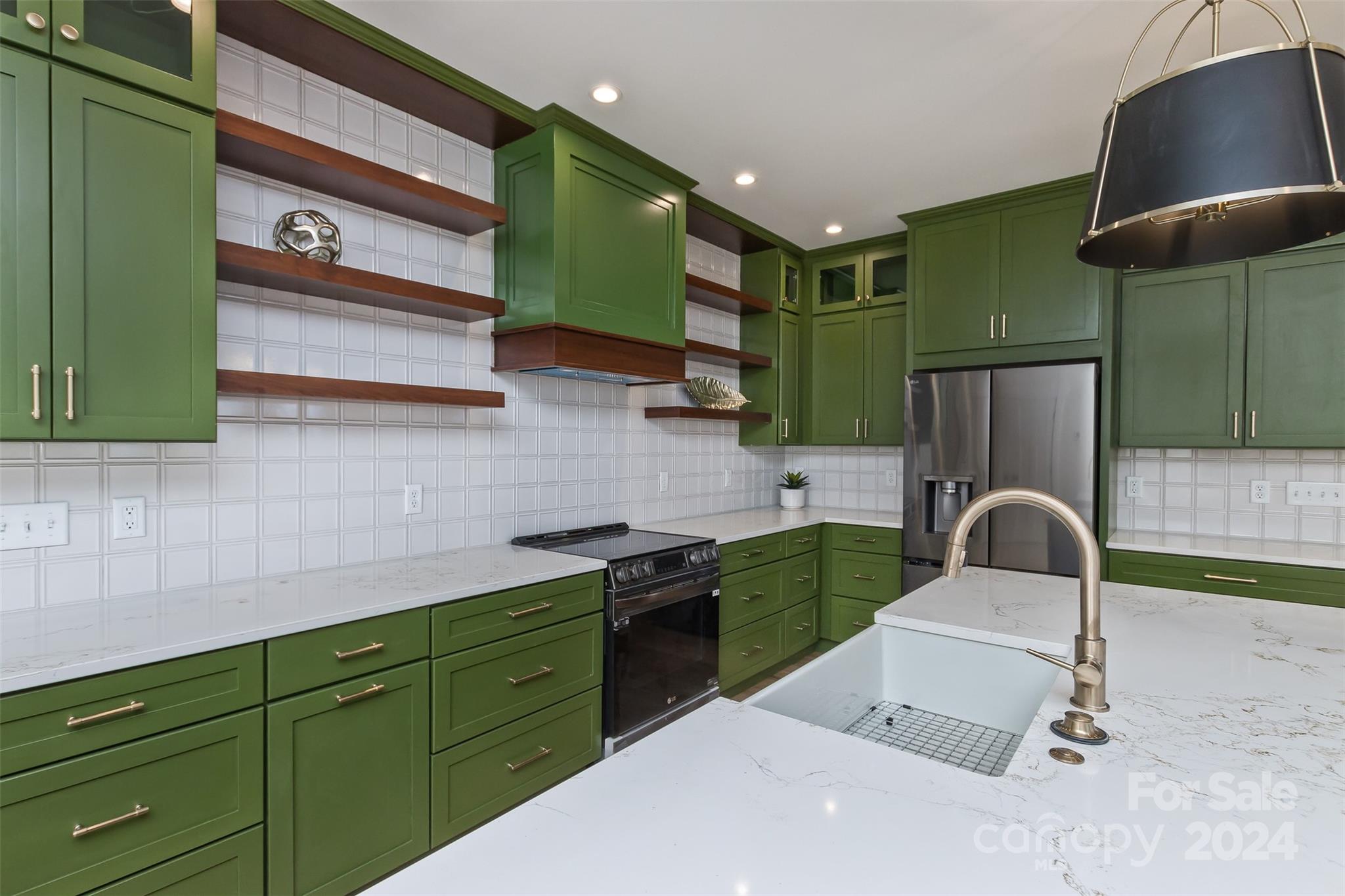 157 Gashes Creek Road Asheville, NC 28805 - Photo 13 of 43 a kitchen with a sink cabinets and a stove