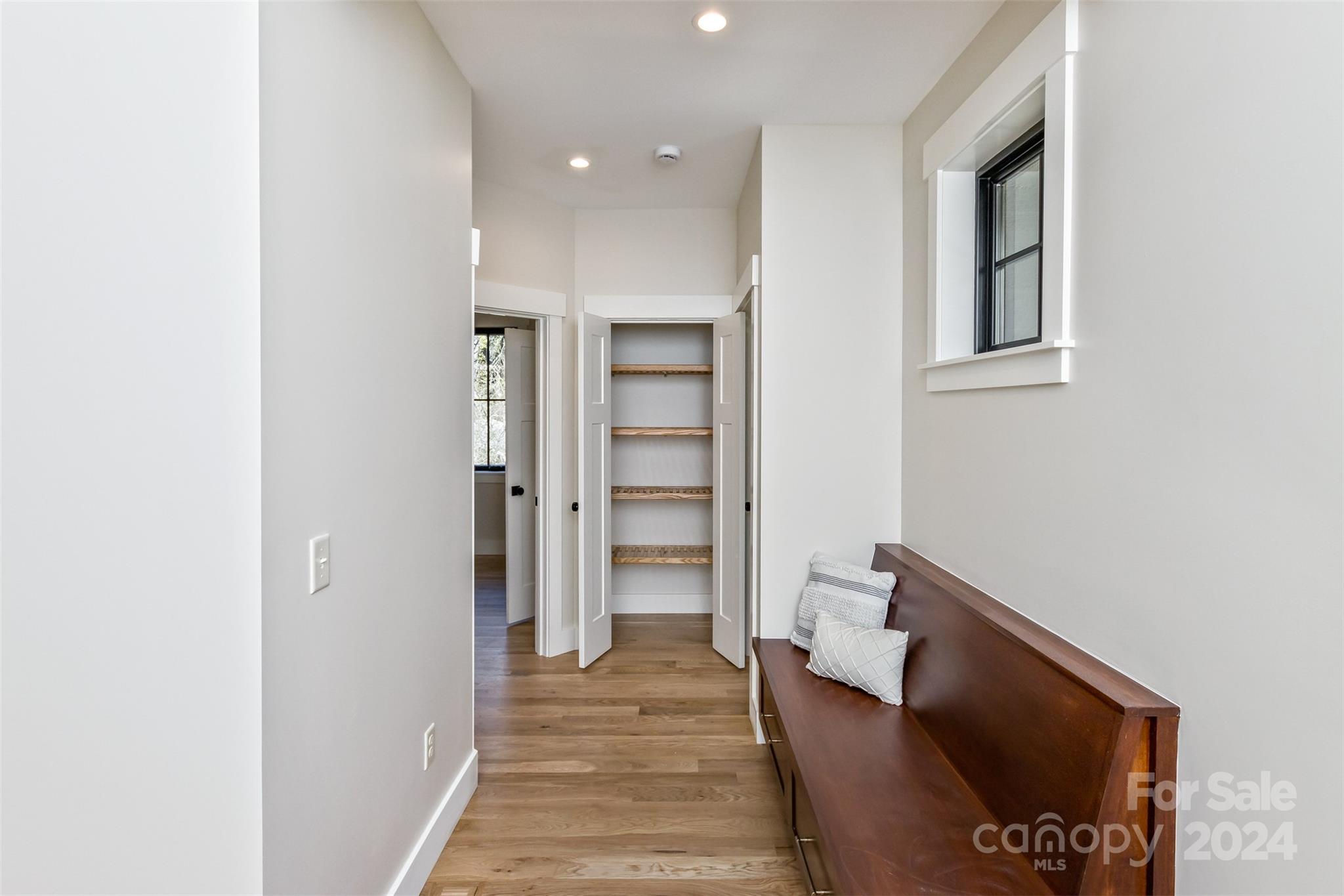 157 Gashes Creek Road Asheville, NC 28805 - Photo 14 of 43 a hallway with wooden floor and staircase