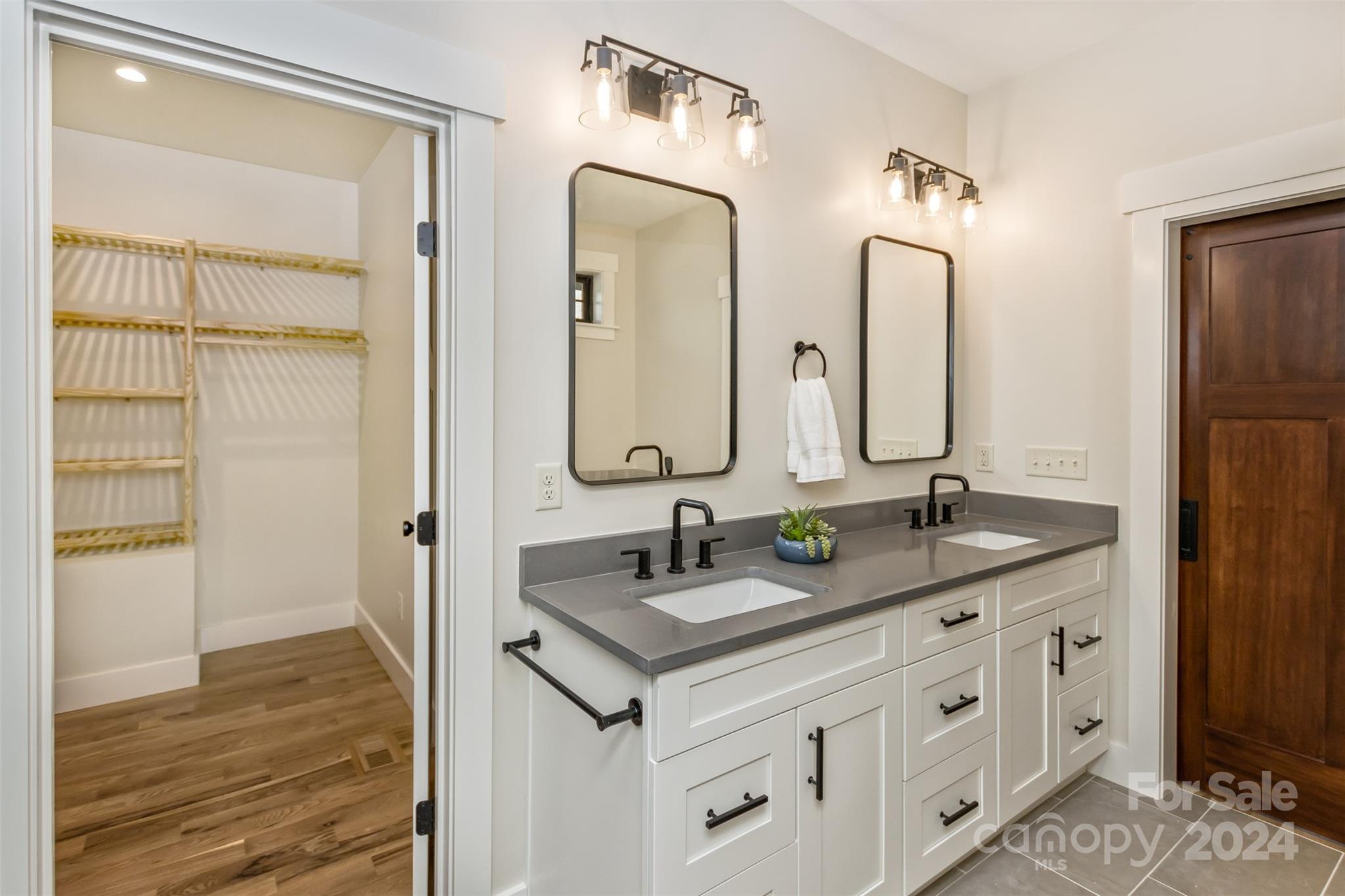 157 Gashes Creek Road Asheville, NC 28805 - Photo 21 of 43 a bathroom with double sink and a mirror