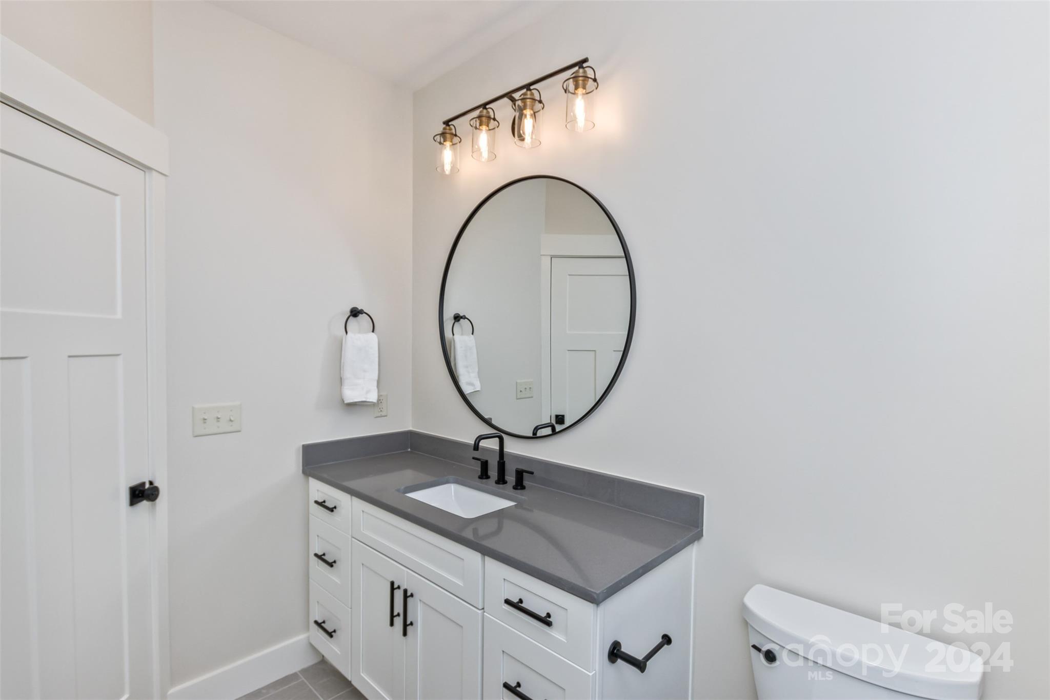 157 Gashes Creek Road Asheville, NC 28805 - Photo 26 of 43 a bathroom with a sink and a mirror