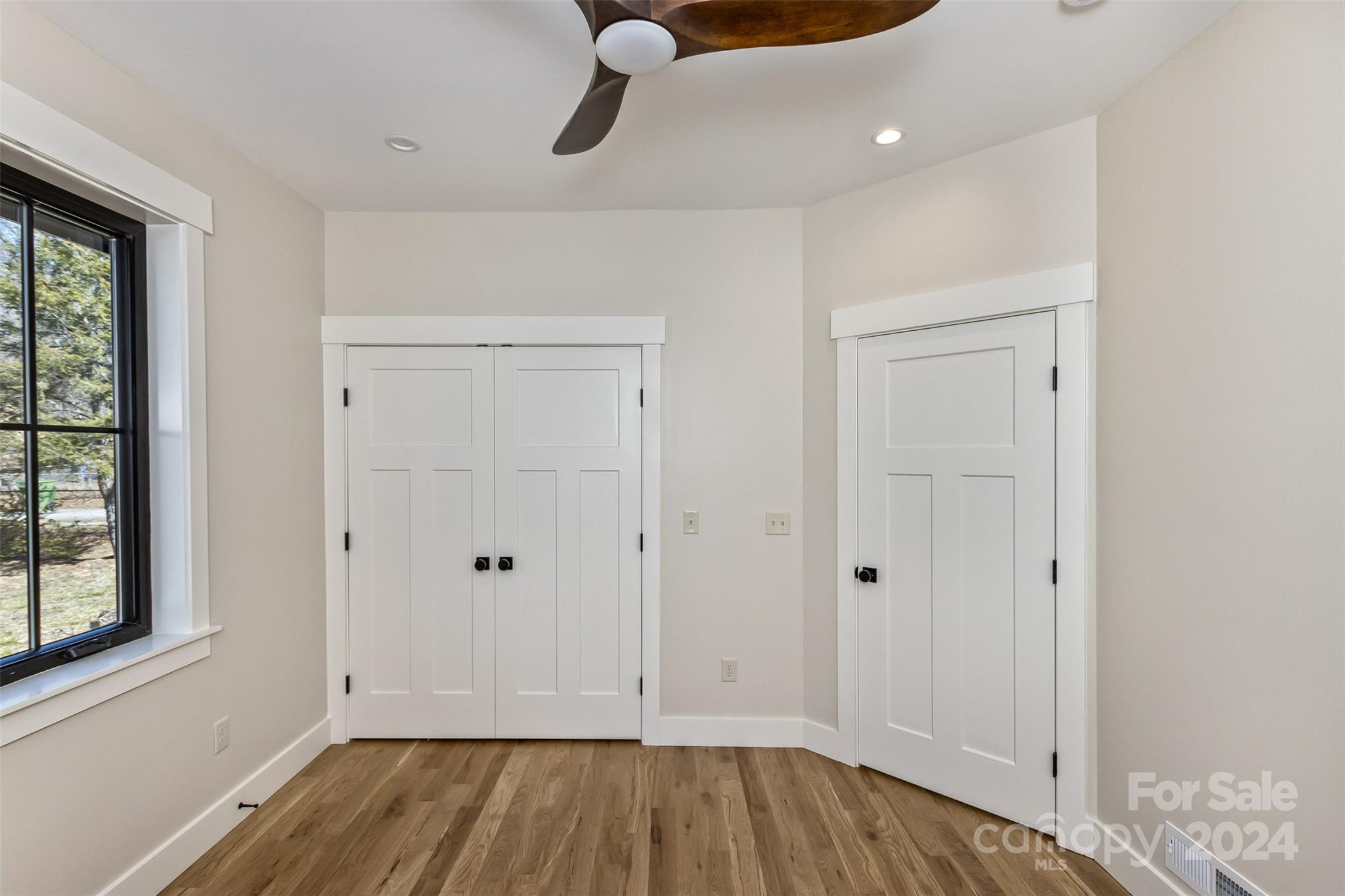 157 Gashes Creek Road Asheville, NC 28805 - Photo 29 of 43 a view of room with hardwood floor and window