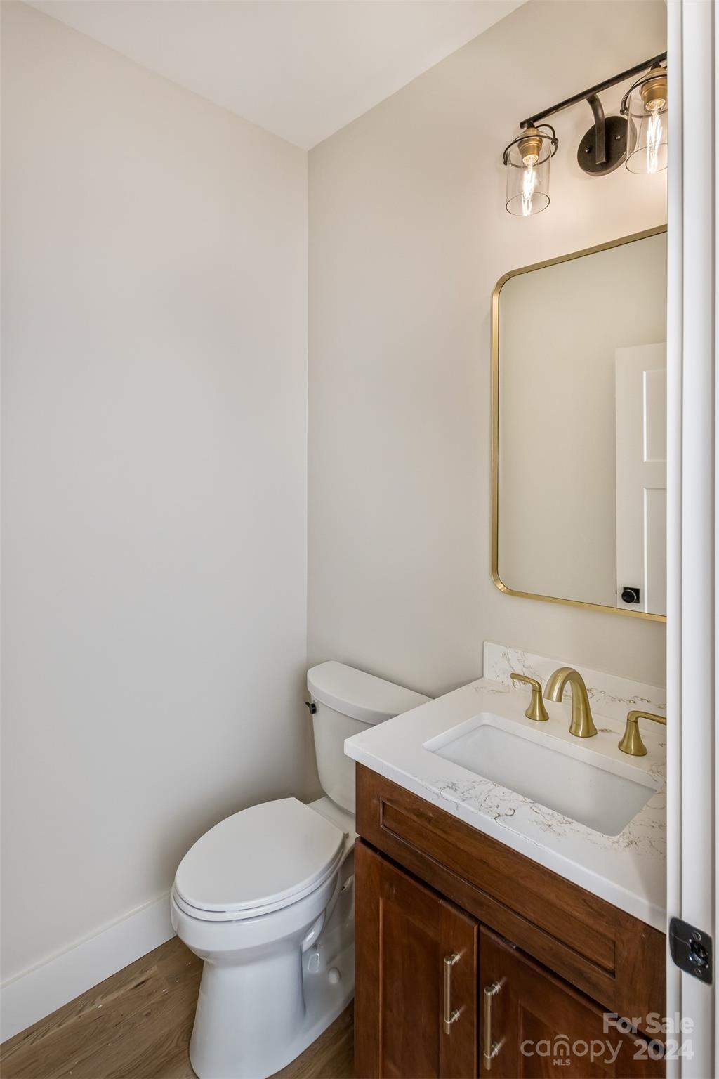 157 Gashes Creek Road Asheville, NC 28805 - Photo 31 of 43 a bathroom with a granite countertop sink vanity mirror and toilet