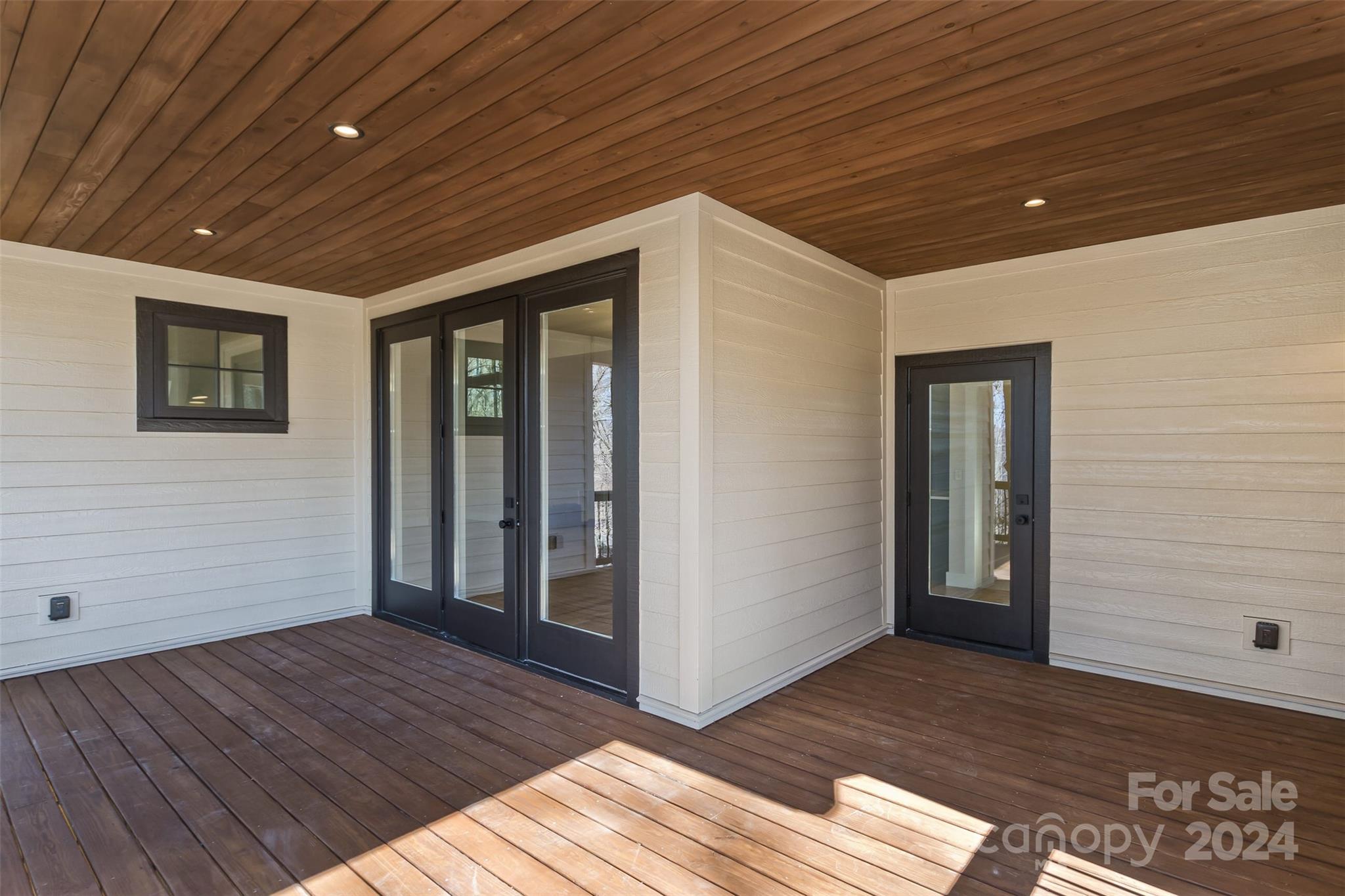 157 Gashes Creek Road Asheville, NC 28805 - Photo 39 of 43 a view of an empty room with wooden floor and a window