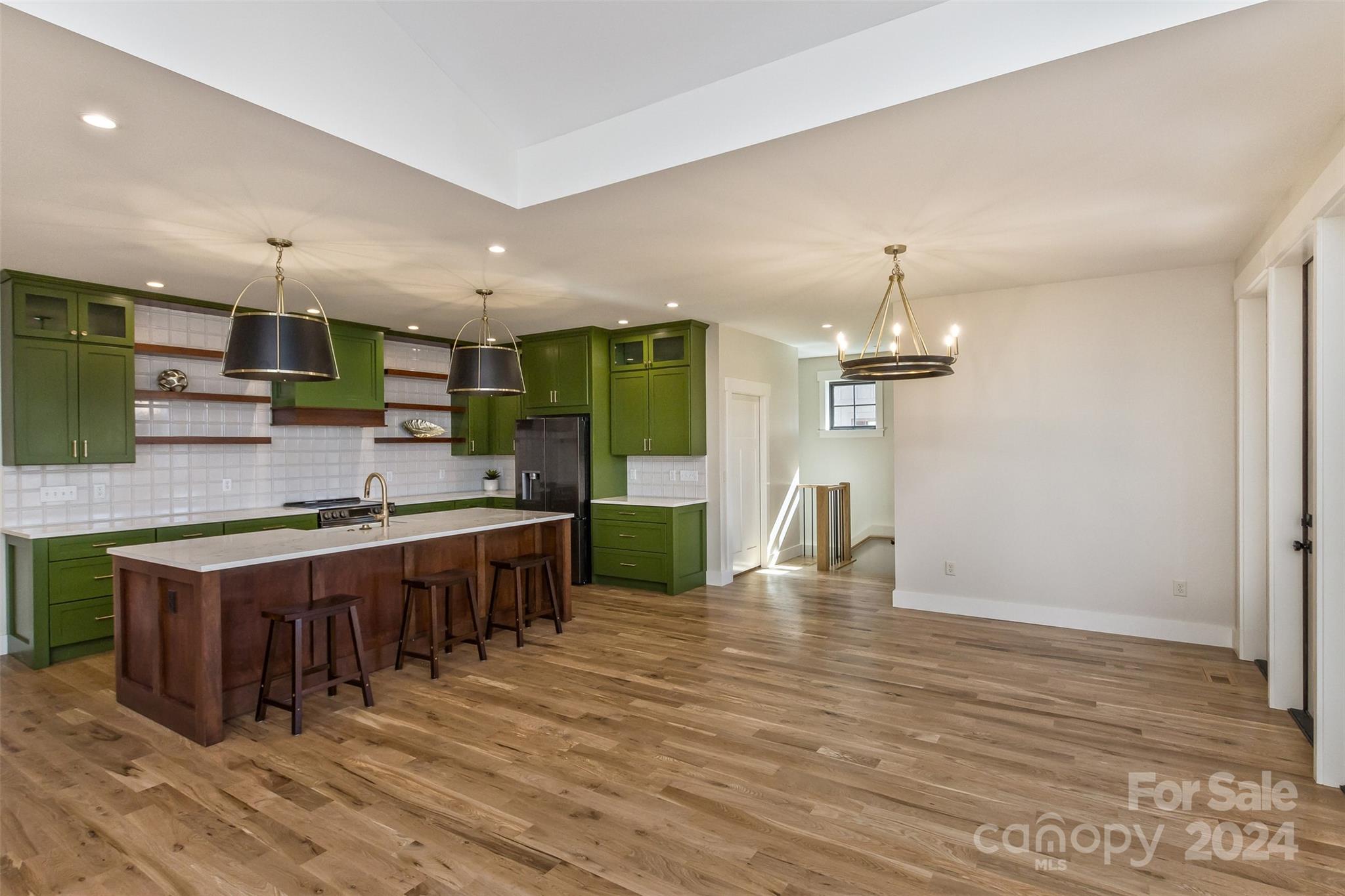 157 Gashes Creek Road Asheville, NC 28805 - Photo 9 of 43 a large kitchen with a table and chairs