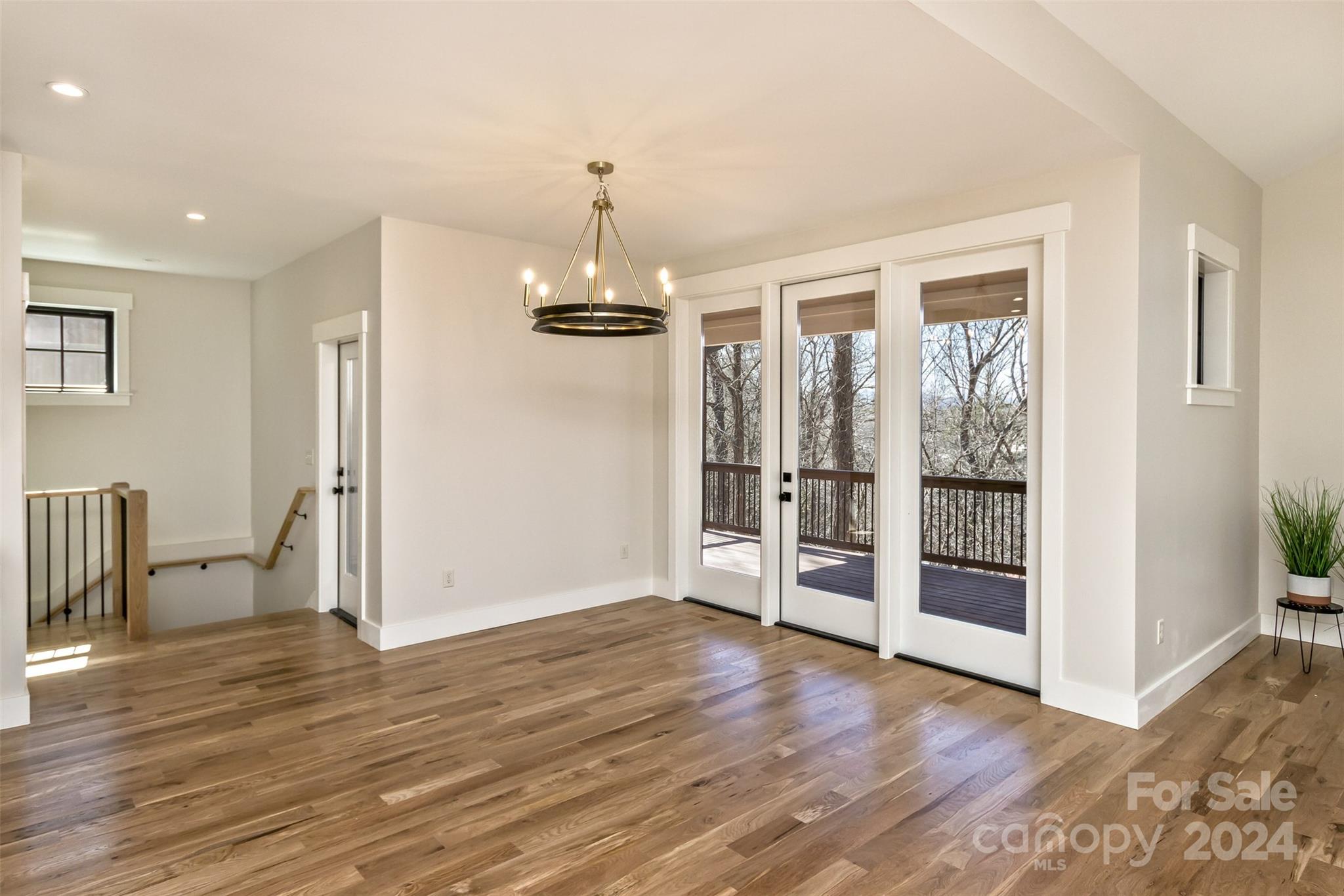 157 Gashes Creek Road Asheville, NC 28805 - Photo 10 of 43 a view of empty room with wooden floor and window