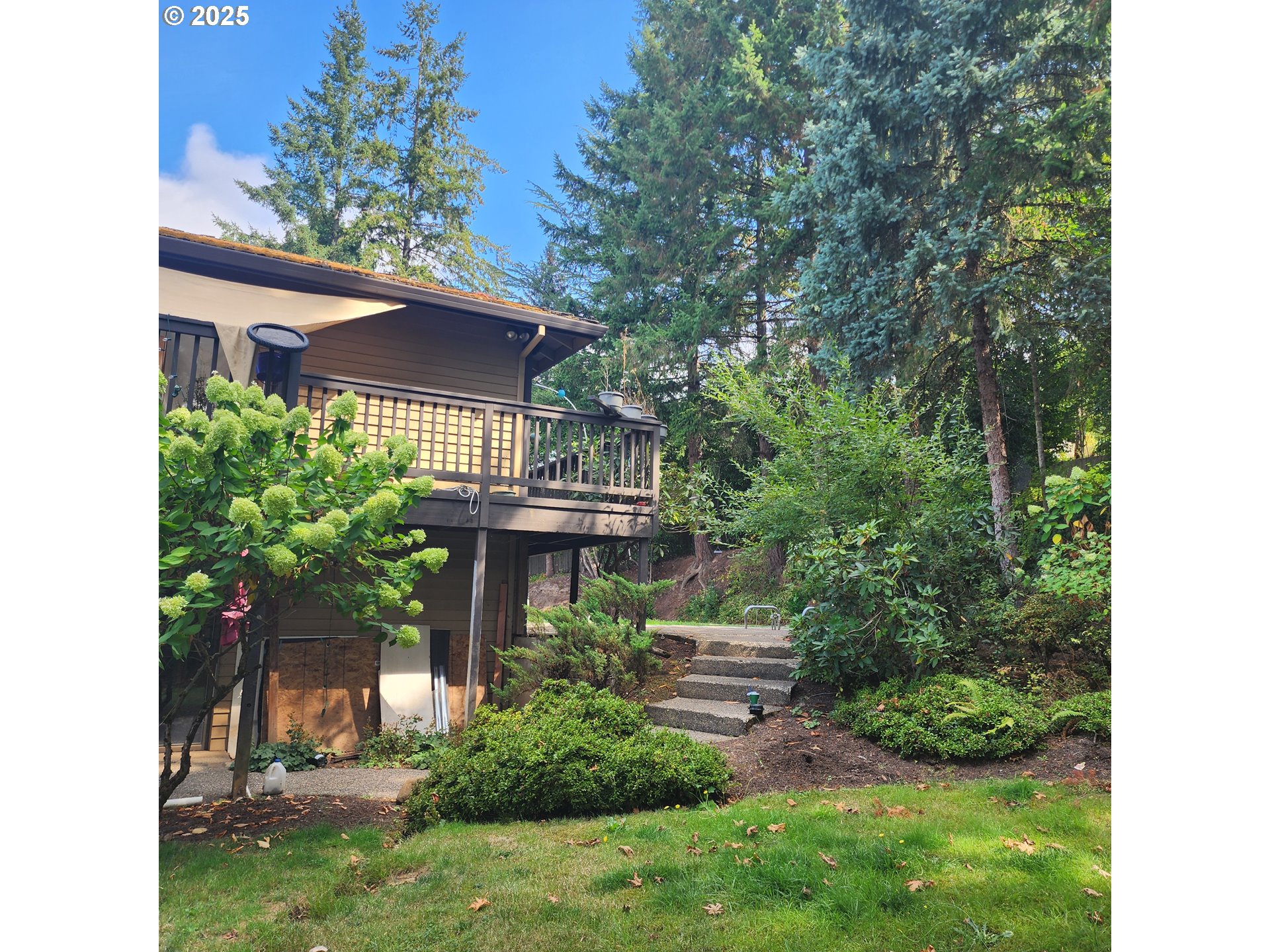 7455 Southwest 195th Avenue Beaverton, OR 97007 - Photo 16 of 21 a view of a house with a yard and potted plants