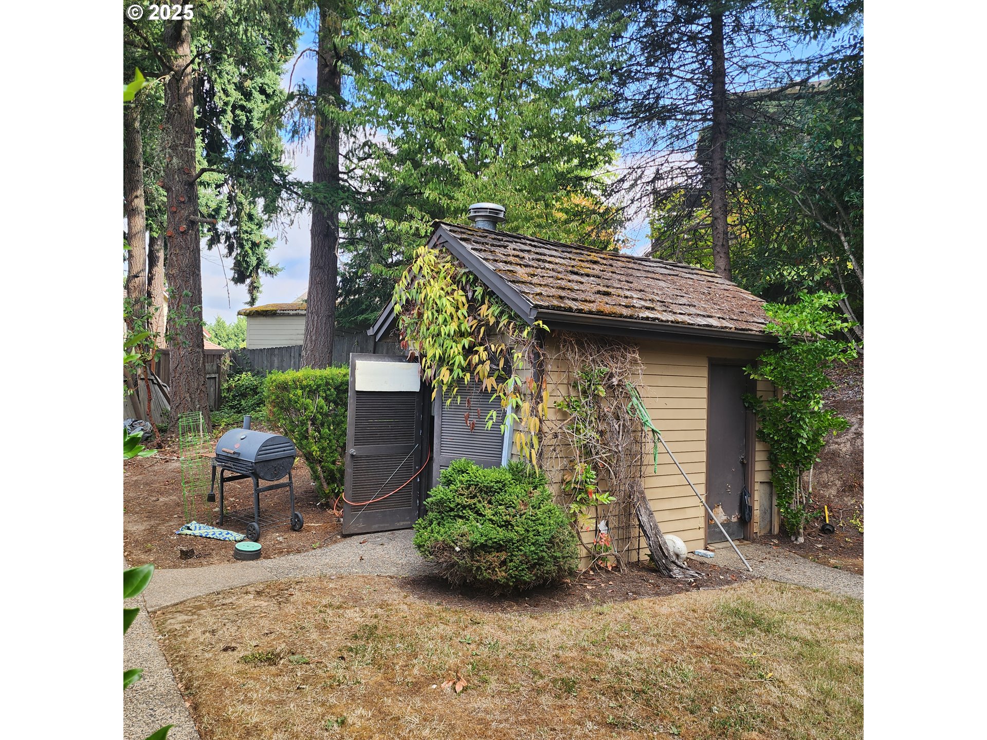 7455 Southwest 195th Avenue Beaverton, OR 97007 - Photo 20 of 21 a view of a chair and table in the backyard