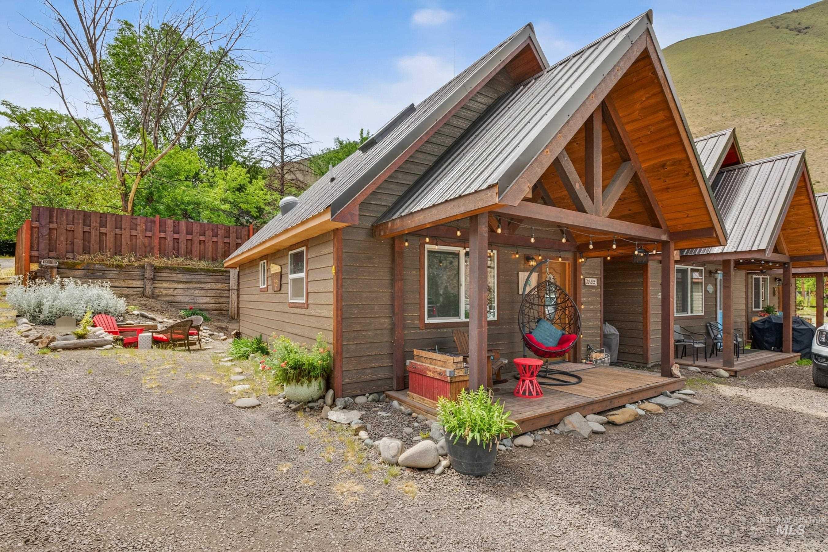 1432 Salmon Drive Riggins, ID 83549 - Photo 26 of 39 A-frame structure with a metal roof and exposed wood beams