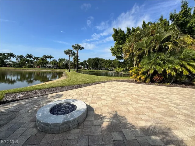 a view of a swimming pool with a yard