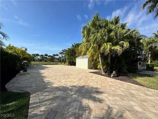 a backyard of a house with lots of green space