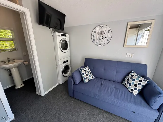 a bed room with a bed and a television