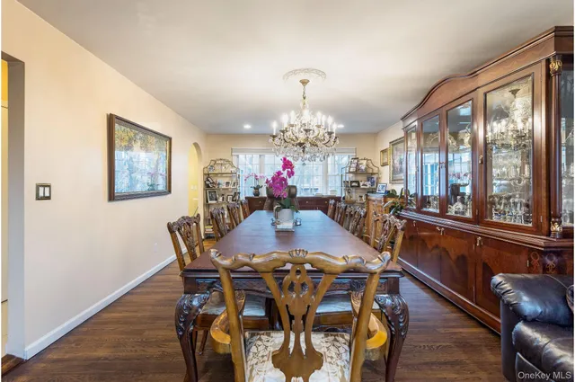 a view of a dining room with furniture large windows and wooden floor