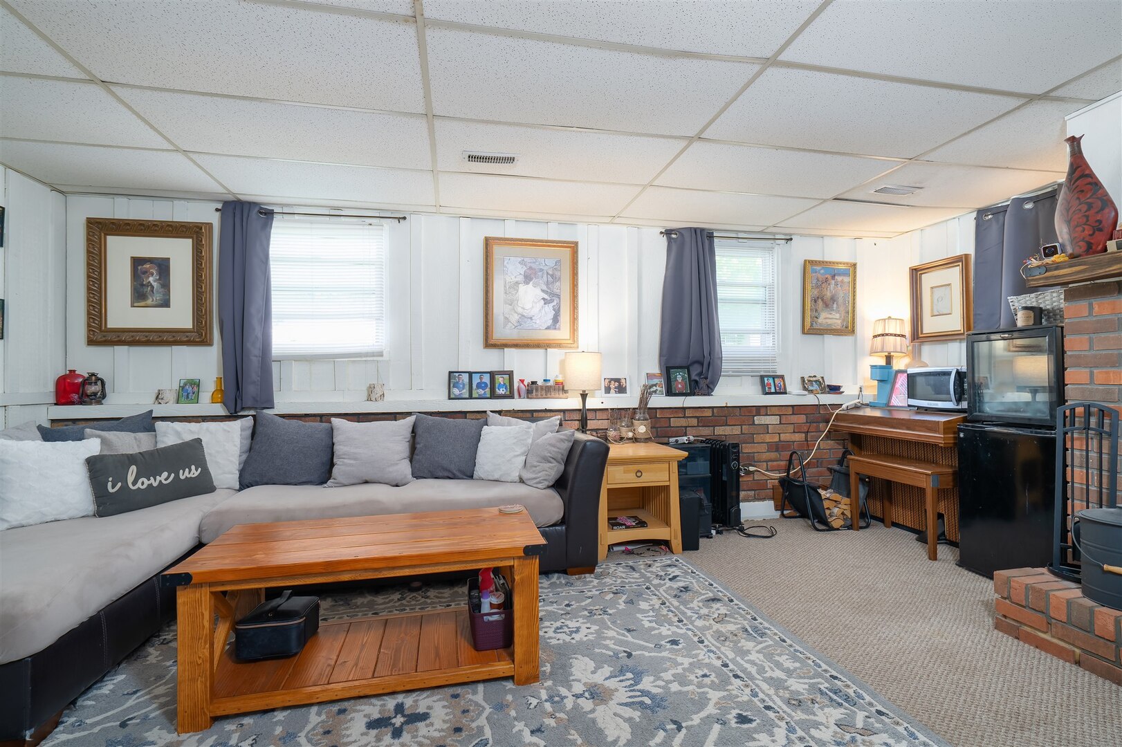1701 Hoover Drive Normal, IL 61761 - Photo 17 of 30 a living room with furniture and a kitchen appliance view
