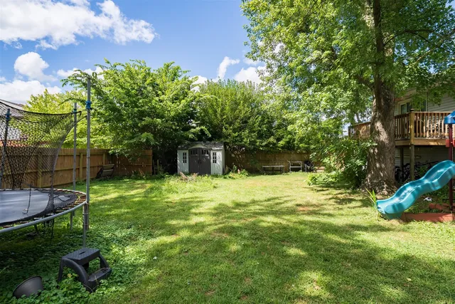 a backyard of a house with lots of green space