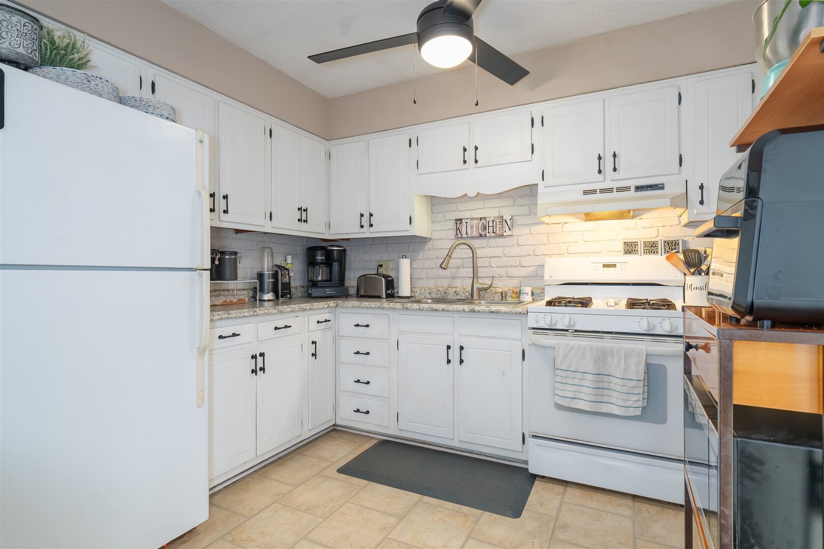 1701 Hoover Drive Normal, IL 61761 - Photo 8 of 30 a kitchen with stainless steel appliances granite countertop a refrigerator sink and white cabinets