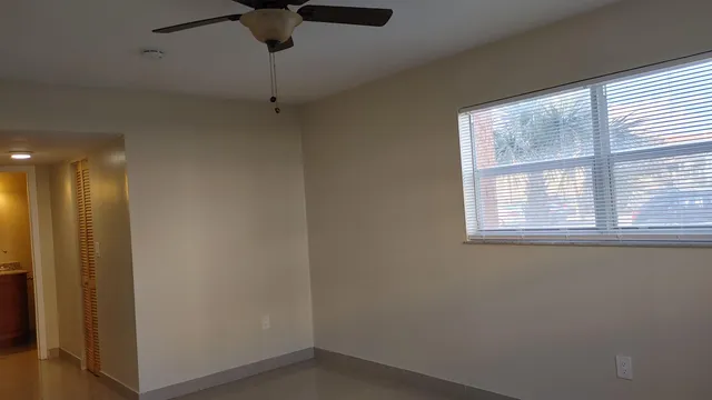 a view of an empty room with a window