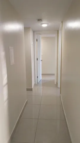 a view of hallway with an empty space