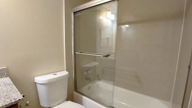a bathroom with a bathtub and a toilet
