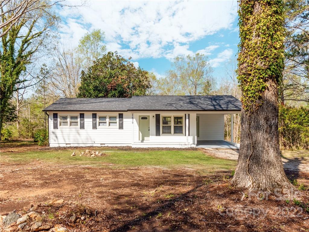 1629 Wadell Stinson Road Lancaster, SC 29720 - Photo 1 of 23 a view of a house with a yard