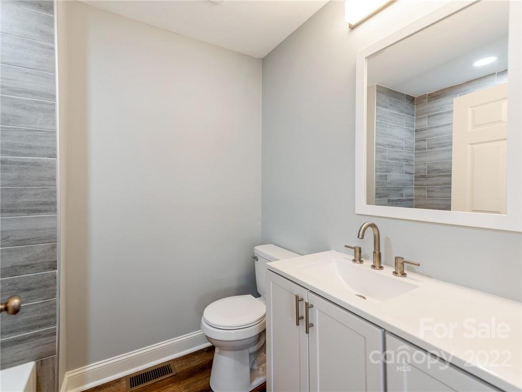1629 Wadell Stinson Road Lancaster, SC 29720 - Photo 18 of 23 a bathroom with a sink a toilet and a mirror