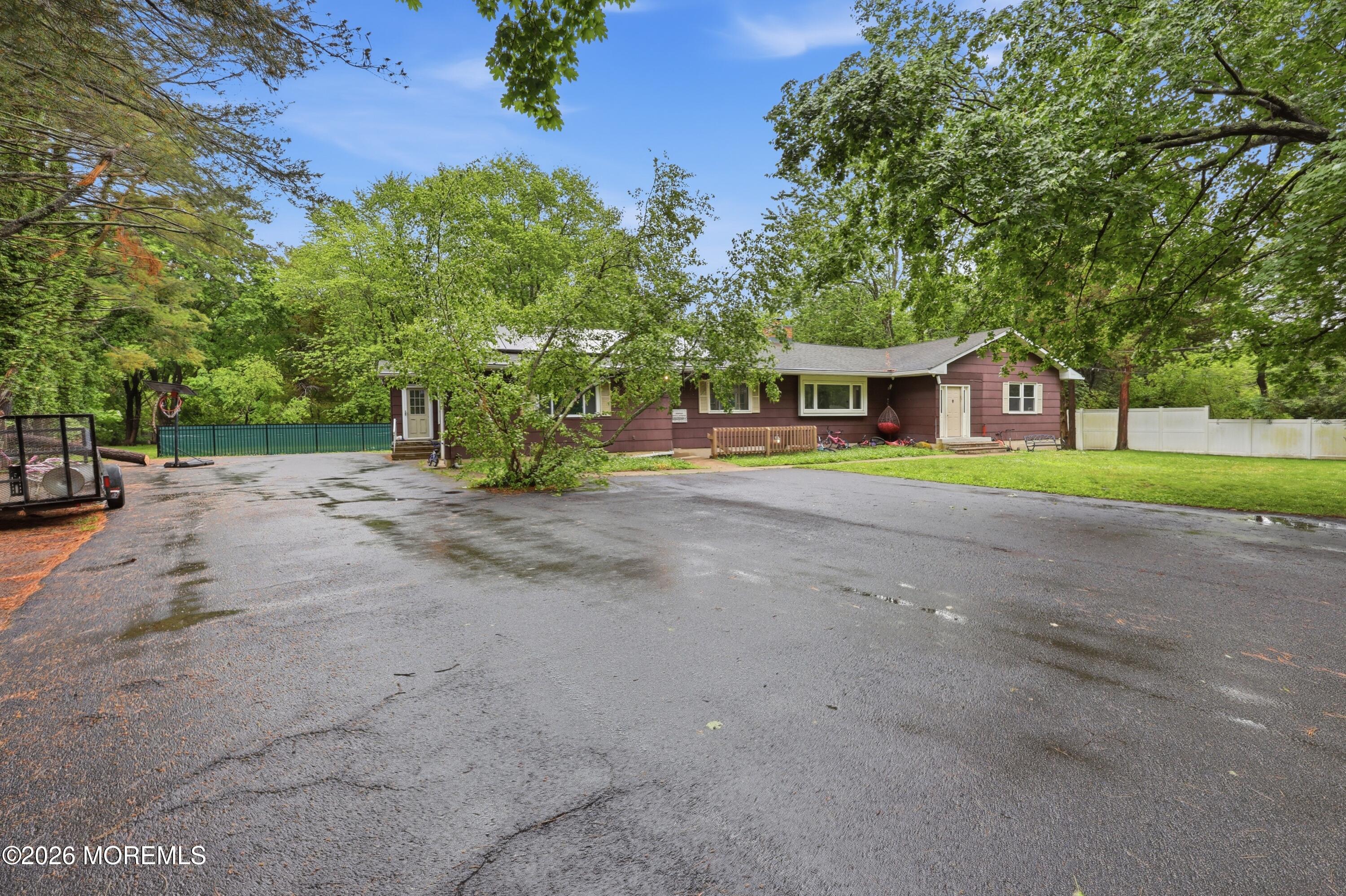 1845 Old Freehold Road Toms River, NJ 08755 - Photo 4 of 27 a view of an house with backyard and trees