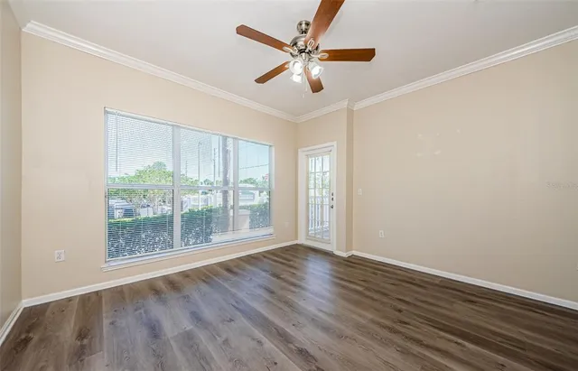 wooden floor in an empty room with a window
